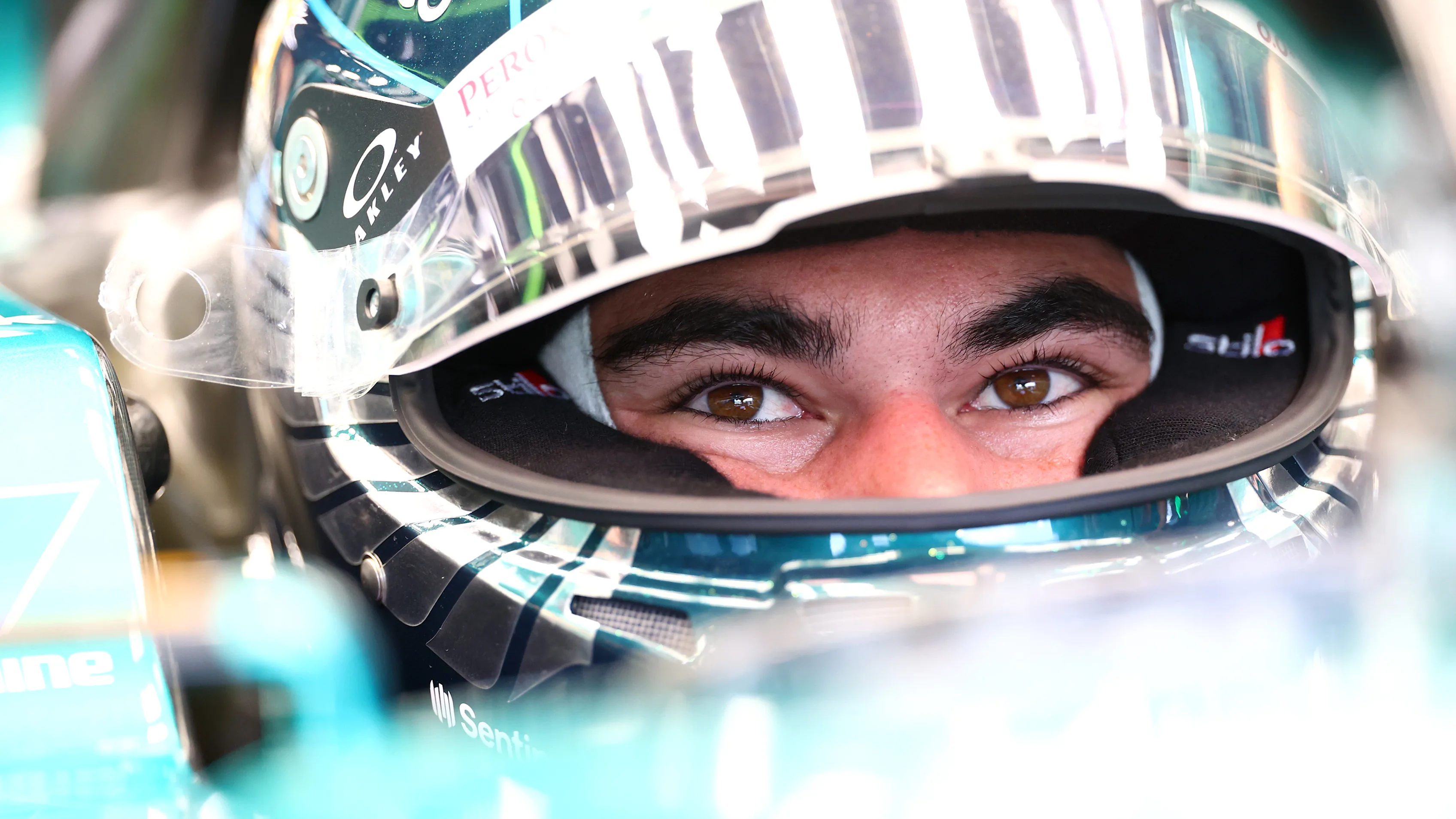 SINGAPORE, SINGAPORE - SEPTEMBER 15: Lance Stroll of Canada and Aston Martin F1 Team prepares to