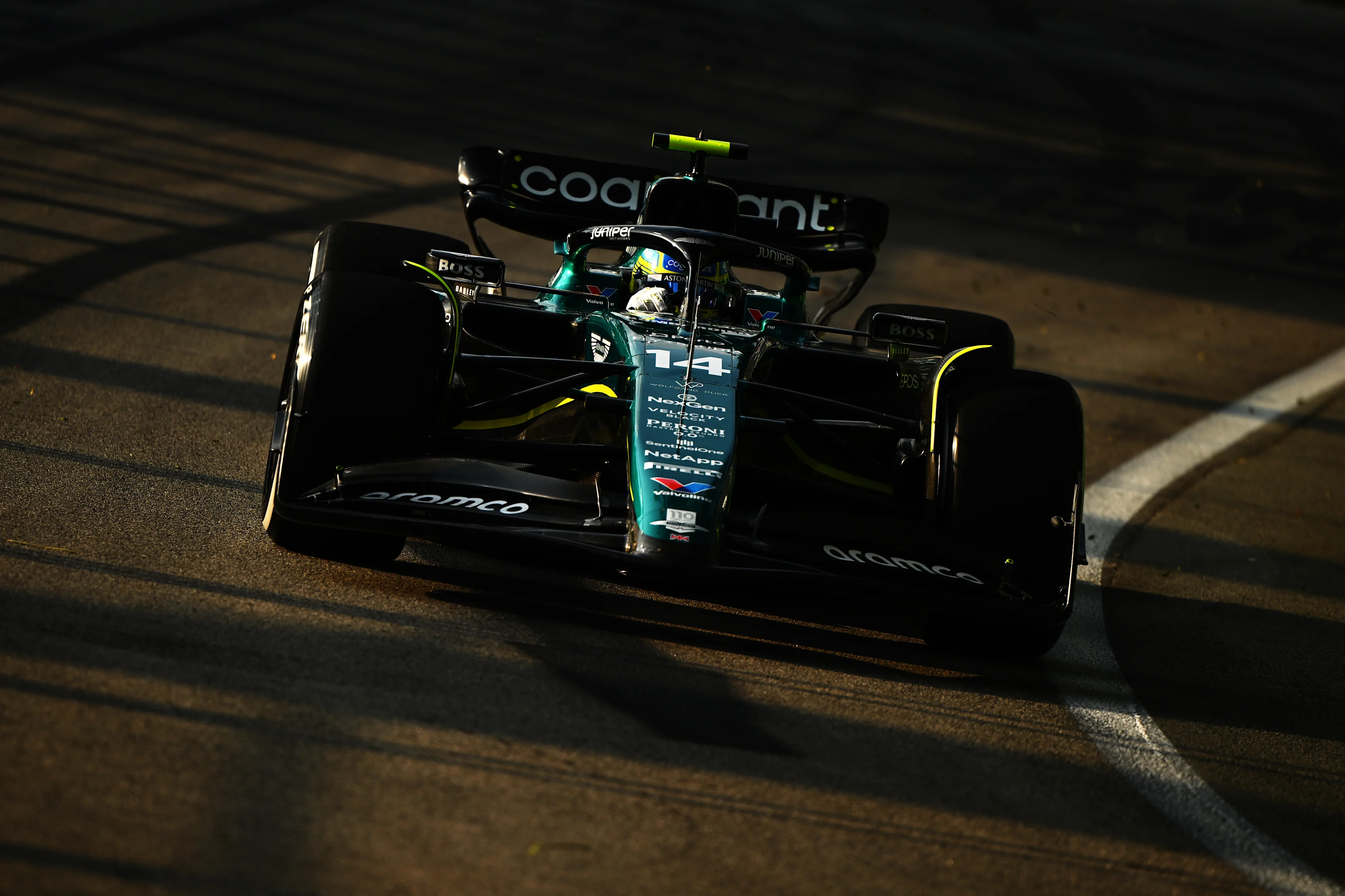 SINGAPORE, SINGAPORE - SEPTEMBER 15: Fernando Alonso of Spain driving the (14) Aston Martin AMR23 Mercedes on track during practice ahead of the F1 Grand Prix of Singapore at Marina Bay Street Circuit on September 15, 2023 in Singapore, Singapore. (Photo by Clive Mason/Getty Images)