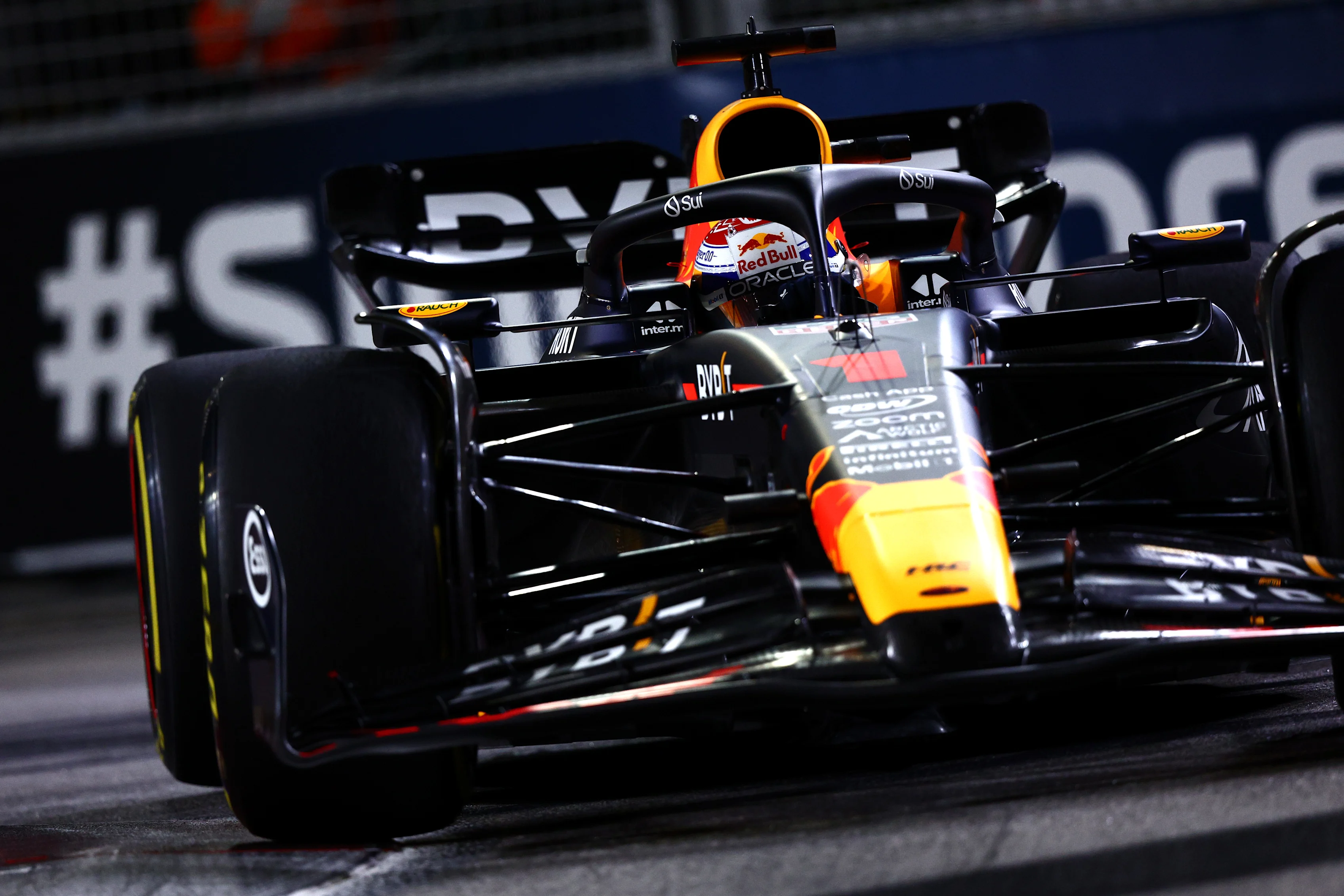 SINGAPORE, SINGAPORE - SEPTEMBER 15: Sparks fly behind Sergio Perez of Mexico driving the (11)