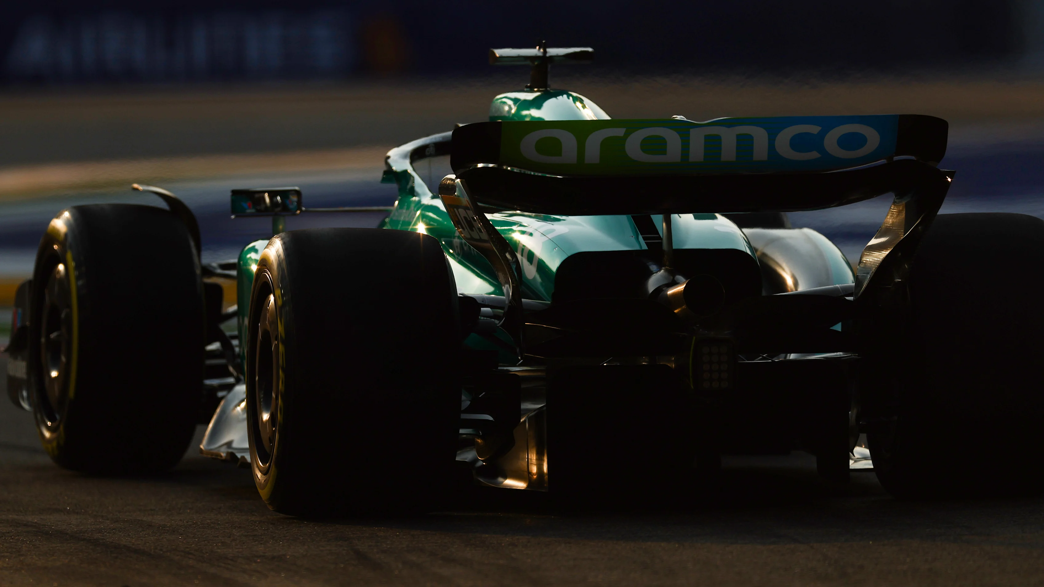 SINGAPORE, SINGAPORE - SEPTEMBER 16: Lance Stroll of Canada driving the (18) Aston Martin AMR23