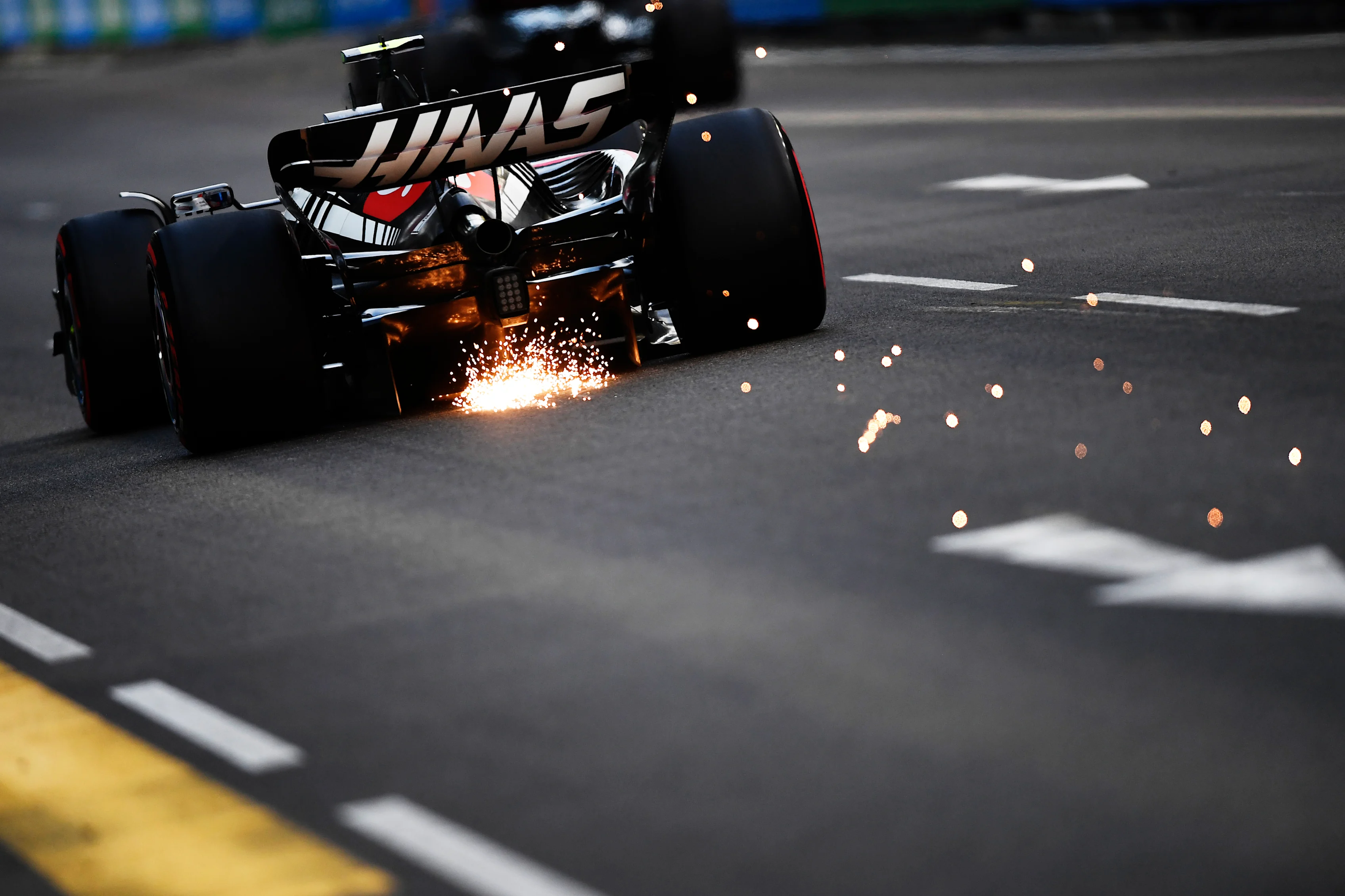 SINGAPORE, SINGAPORE - SEPTEMBER 16: Sparks fly behind Nico Hulkenberg of Germany driving the (27)