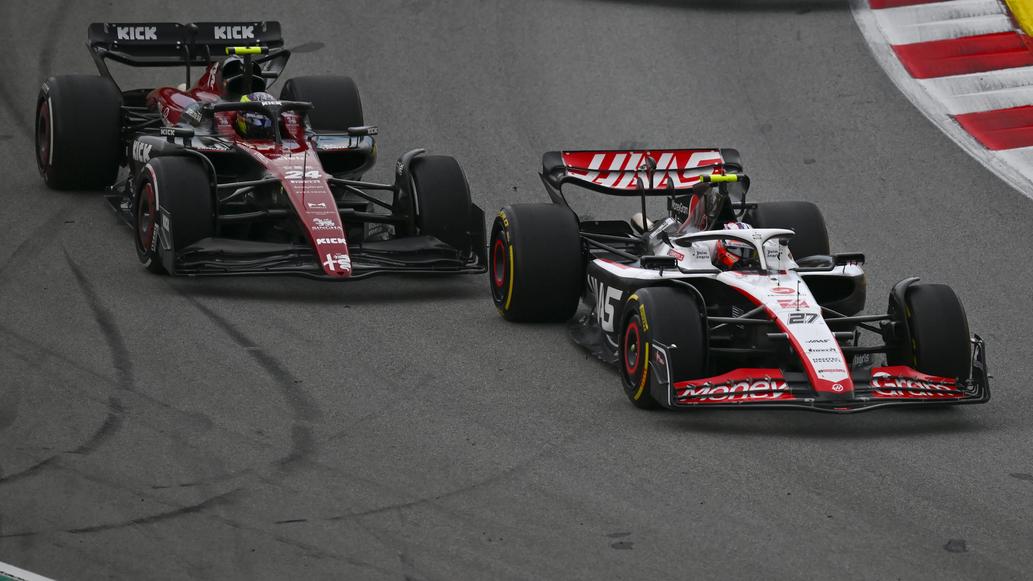 BARCELONA, SPAIN - JUNE 04: Nico Hulkenberg of Germany driving the (27) Haas F1 VF-23 Ferrari leads Zhou Guanyu of China driving the (24) Alfa Romeo F1 C43 Ferrari on track during the F1 Grand Prix of Spain at Circuit de Barcelona-Catalunya on June 04, 2023 in Barcelona, Spain. (Photo by Dan Mullan - Formula 1/Formula 1 via Getty Images)