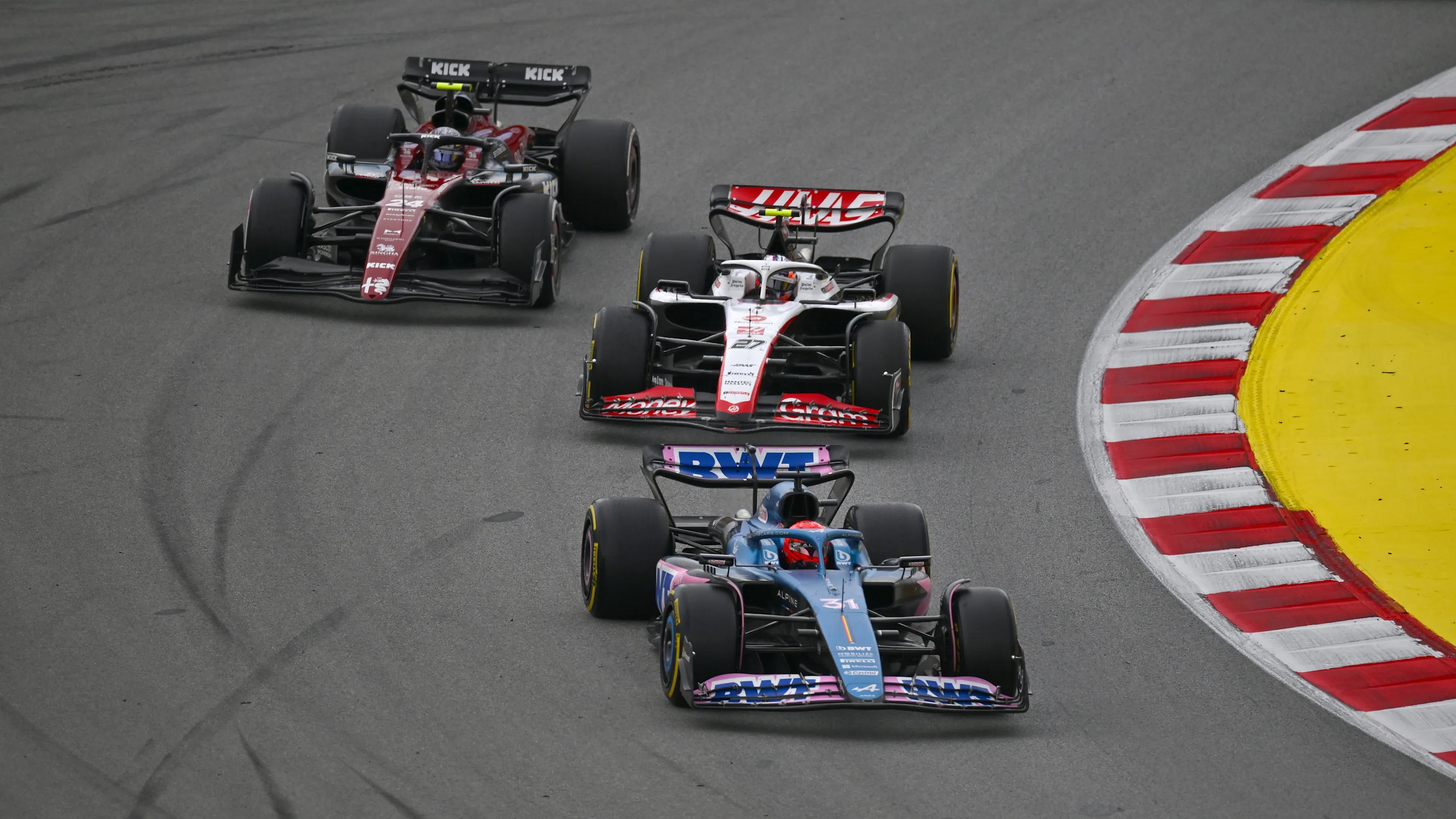 BARCELONA, SPAIN - JUNE 04: Esteban Ocon of France driving the (31) Alpine F1 A523 Renault leads Nico Hulkenberg of Germany driving the (27) Haas F1 VF-23 Ferrari and Zhou Guanyu of China driving the (24) Alfa Romeo F1 C43 Ferrari on track during the F1 Grand Prix of Spain at Circuit de Barcelona-Catalunya on June 04, 2023 in Barcelona, Spain. (Photo by Dan Mullan - Formula 1/Formula 1 via Getty Images)
