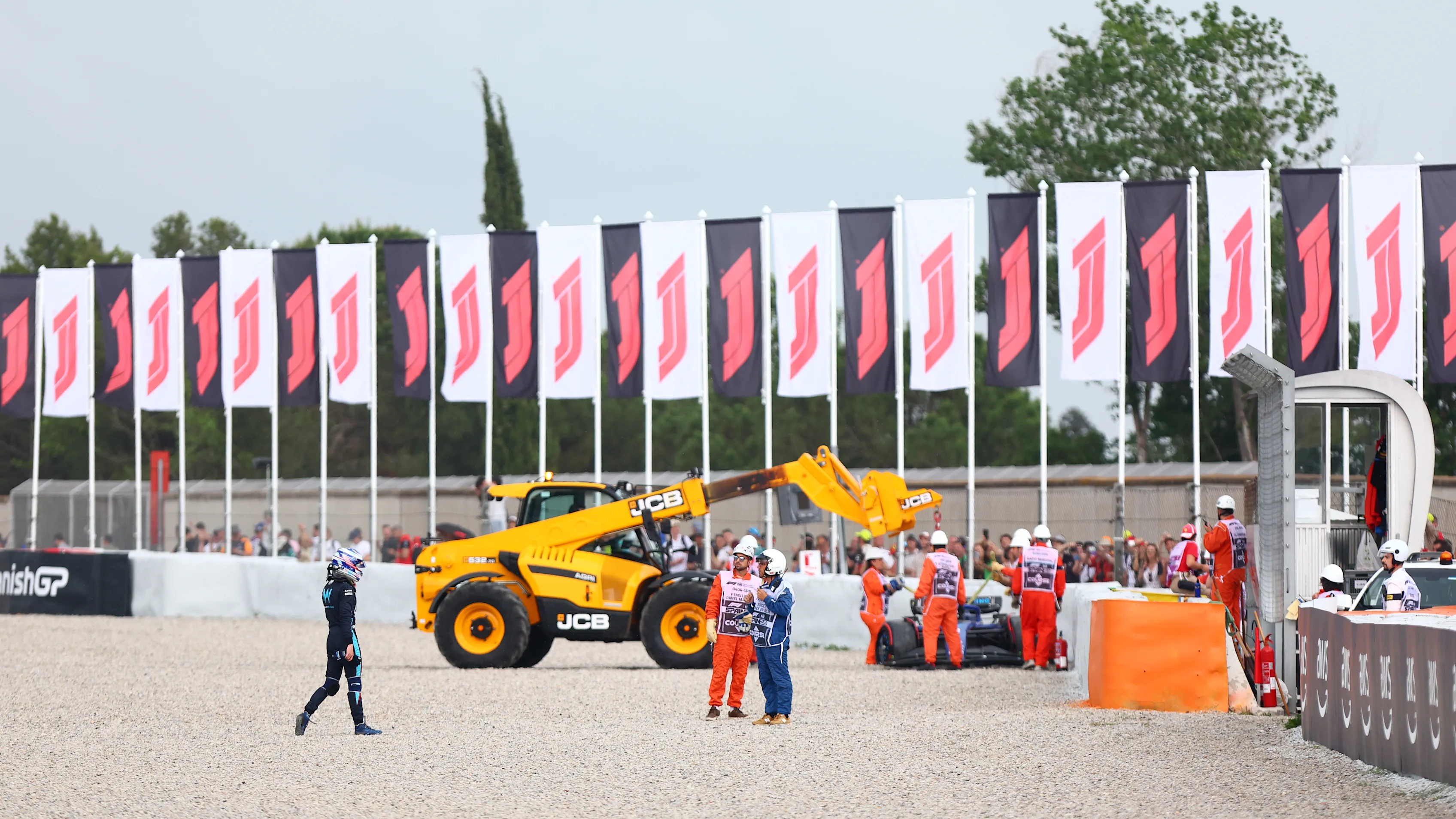 BARCELONA, SPAIN - JUNE 03: Logan Sargeant of United States and Williams walks from his car after crashing during final practice ahead of the F1 Grand Prix of Spain at Circuit de Barcelona-Catalunya on June 03, 2023 in Barcelona, Spain. (Photo by Dan Istitene - Formula 1/Formula 1 via Getty Images)