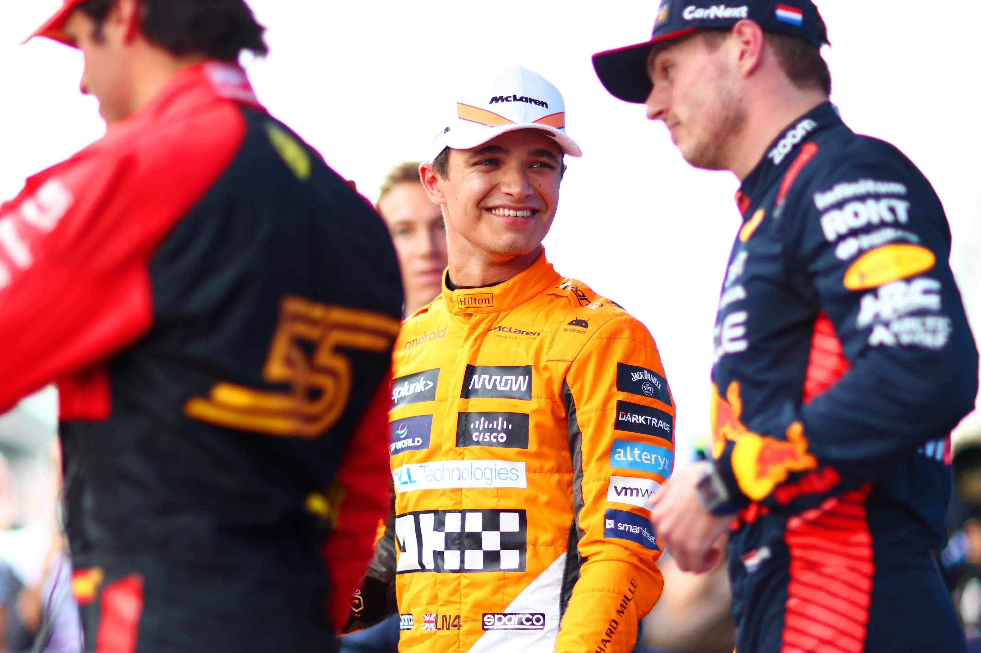 BARCELONA, SPAIN - JUNE 03: Third placed qualifier Lando Norris of Great Britain and McLaren smiles as he speaks with Pole position qualifier Max Verstappen of the Netherlands and Oracle Red Bull Racing and Second placed qualifier Carlos Sainz of Spain and Ferrari in parc ferme during qualifying ahead of the F1 Grand Prix of Spain at Circuit de Barcelona-Catalunya on June 03, 2023 in Barcelona, Spain. (Photo by Dan Istitene - Formula 1/Formula 1 via Getty Images)