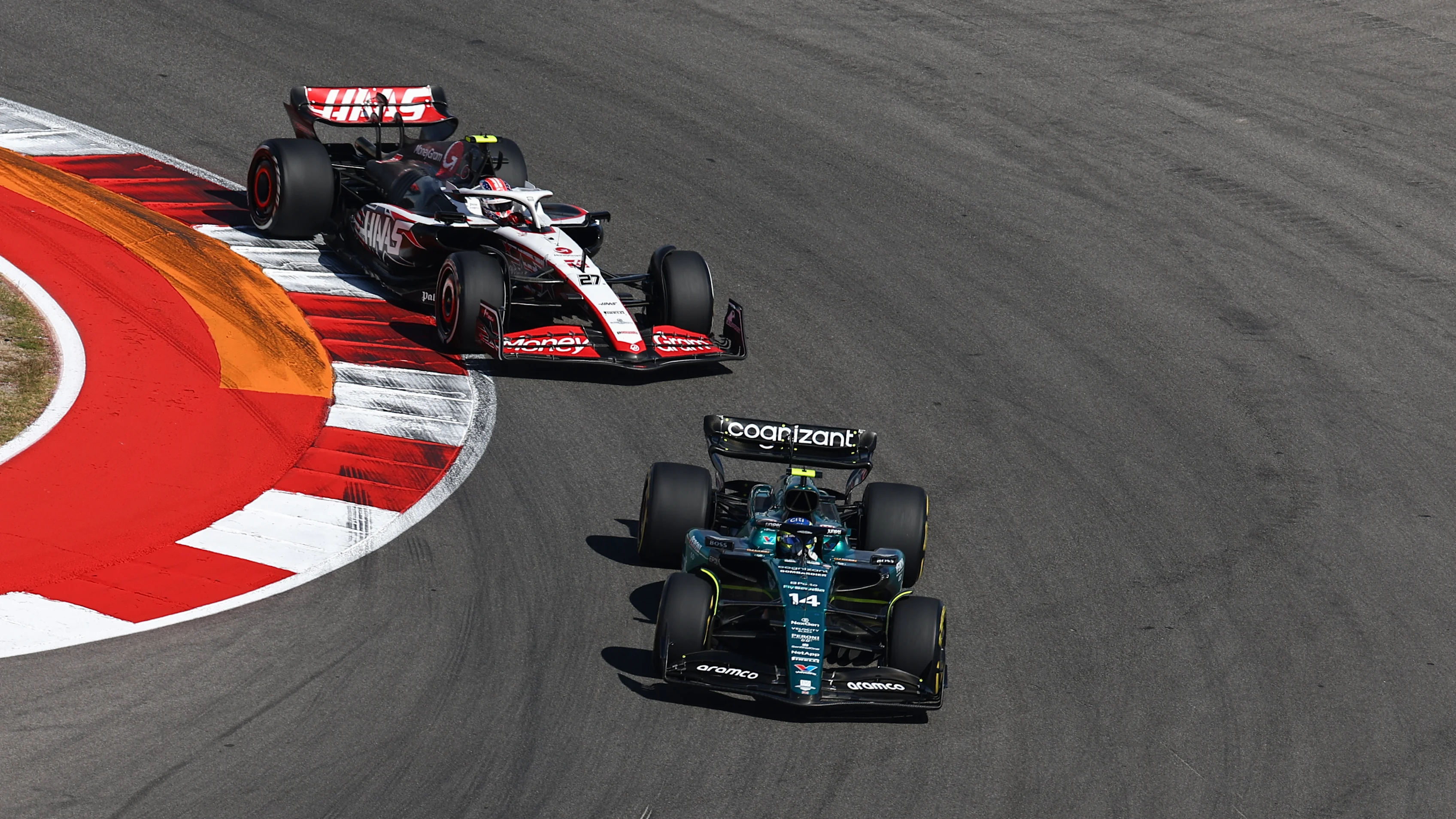 AUSTIN, TEXAS - OCTOBER 22: Fernando Alonso of Spain driving the (14) Aston Martin AMR23 Mercedes leads Nico Hulkenberg of Germany driving the (27) Haas F1 VF-23 Ferrari during the F1 Grand Prix of United States at Circuit of The Americas on October 22, 2023 in Austin, Texas. (Photo by Jared C. Tilton - Formula 1/Formula 1 via Getty Images)