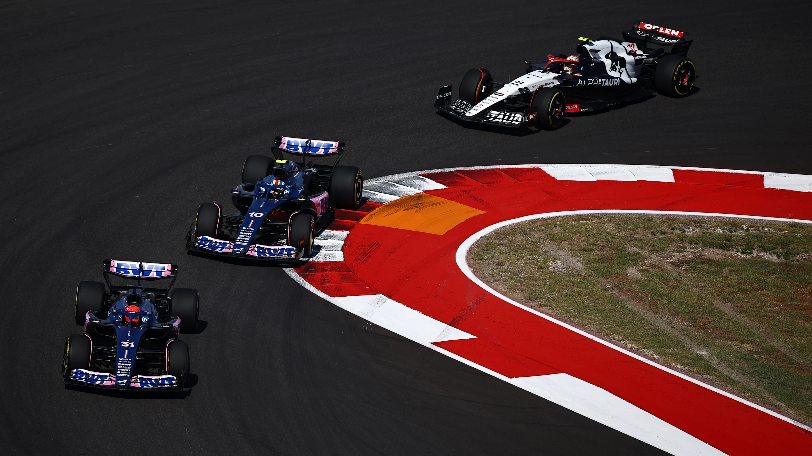 AUSTIN, TEXAS - OCTOBER 22: Esteban Ocon of France driving the (31) Alpine F1 A523 Renault leads Pierre Gasly of France driving the (10) Alpine F1 A523 Renault and Yuki Tsunoda of Japan driving the (22) Scuderia AlphaTauri AT04 on track during the F1 Grand Prix of United States at Circuit of The Americas on October 22, 2023 in Austin, Texas. (Photo by Jared C. Tilton - Formula 1/Formula 1 via Getty Images)