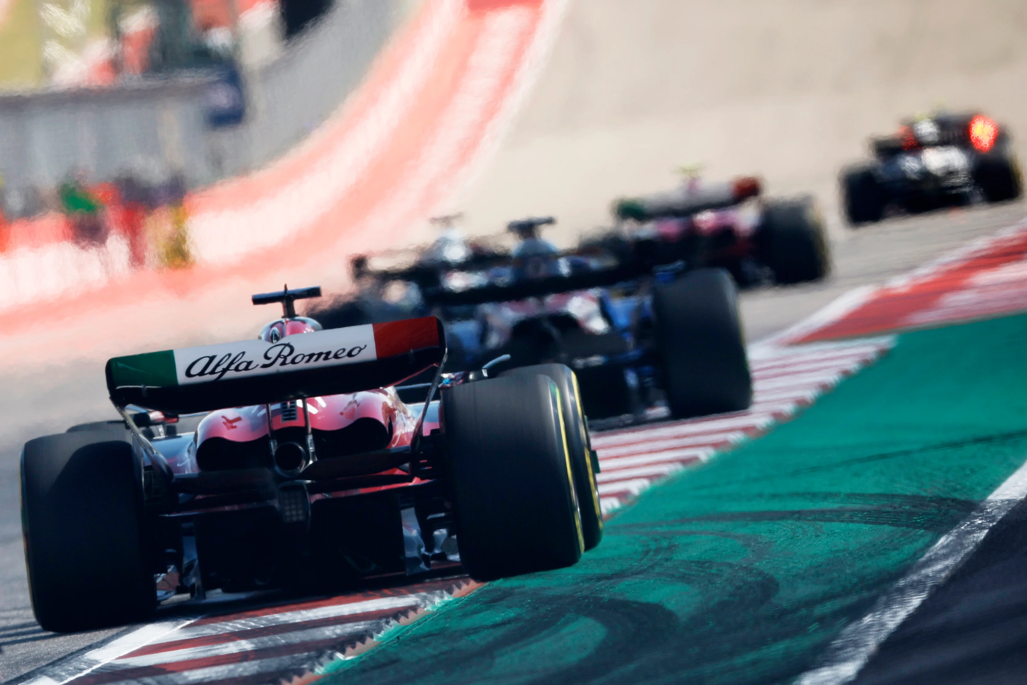 AUSTIN, TEXAS - OCTOBER 22: Valtteri Bottas of Finland driving the (77) Alfa Romeo F1 C43 Ferrari chases a line of cars during the F1 Grand Prix of United States at Circuit of The Americas on October 22, 2023 in Austin, Texas. (Photo by Chris Graythen/Getty Images)
