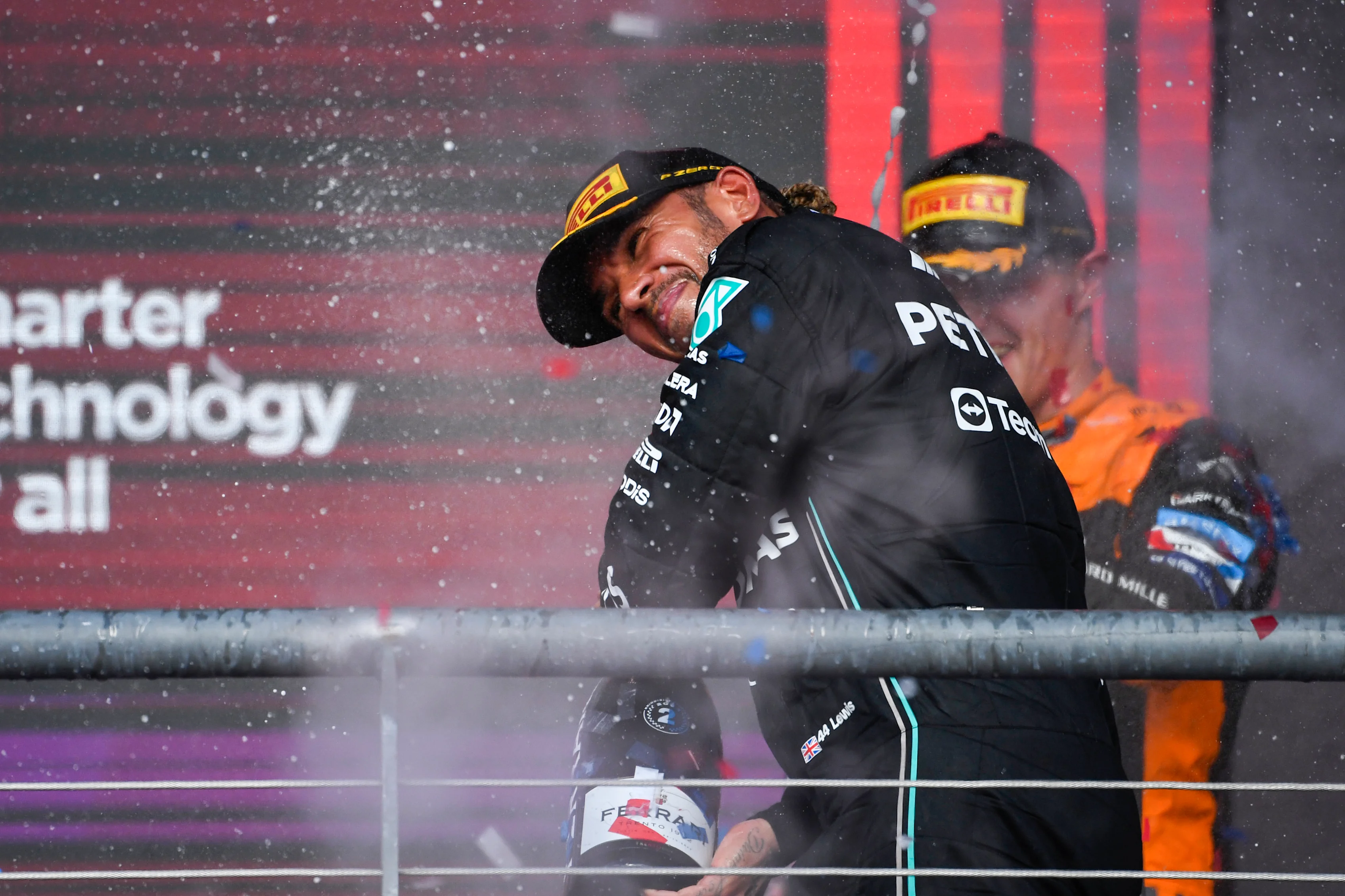 AUSTIN, TEXAS - OCTOBER 22: Second placed Lewis Hamilton of Great Britain and Mercedes celebrates on the podium during the F1 Grand Prix of United States at Circuit of The Americas on October 22, 2023 in Austin, Texas. (Photo by Rudy Carezzevoli/Getty Images)
