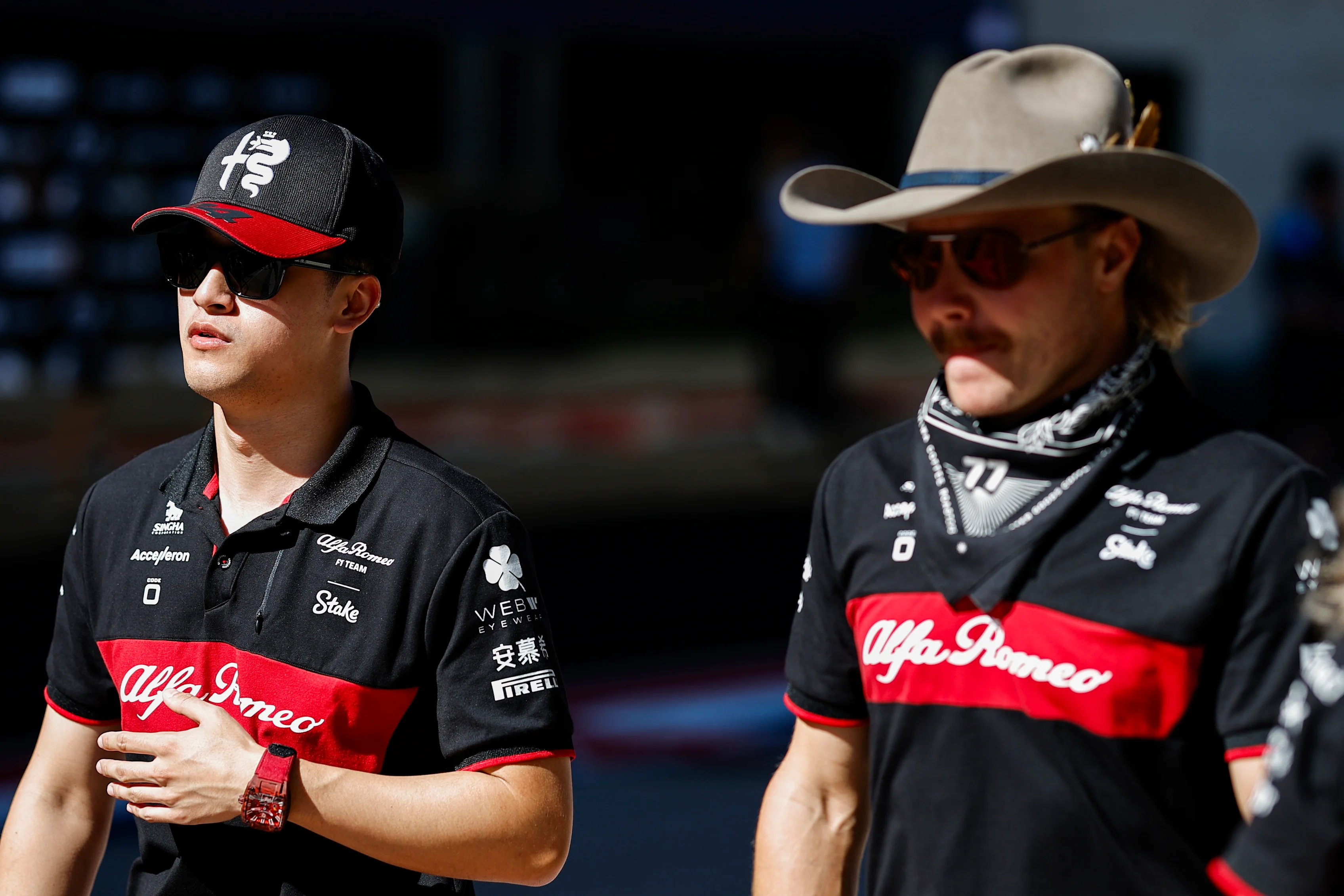 AUSTIN, TEXAS - OCTOBER 20: Zhou Guanyu of China driving the (24) Alfa Romeo F1 C43 Ferrari walks