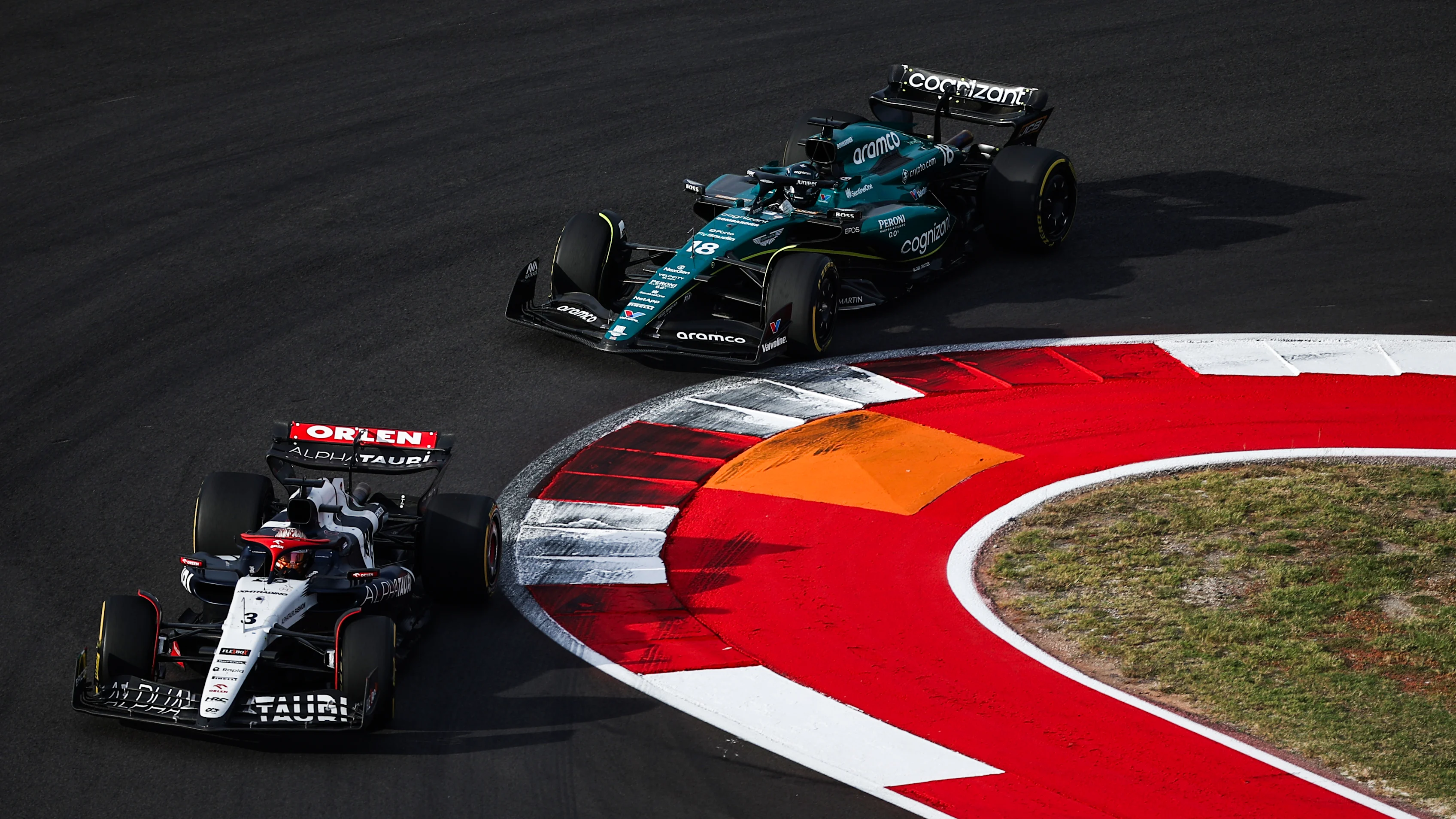 AUSTIN, TEXAS - OCTOBER 21: Daniel Ricciardo of Australia driving the (3) Scuderia AlphaTauri AT04 leads Lance Stroll of Canada driving the (18) Aston Martin AMR23 Mercedes during the Sprint ahead of the F1 Grand Prix of United States at Circuit of The Americas on October 21, 2023 in Austin, Texas. (Photo by Jared C. Tilton - Formula 1/Formula 1 via Getty Images)