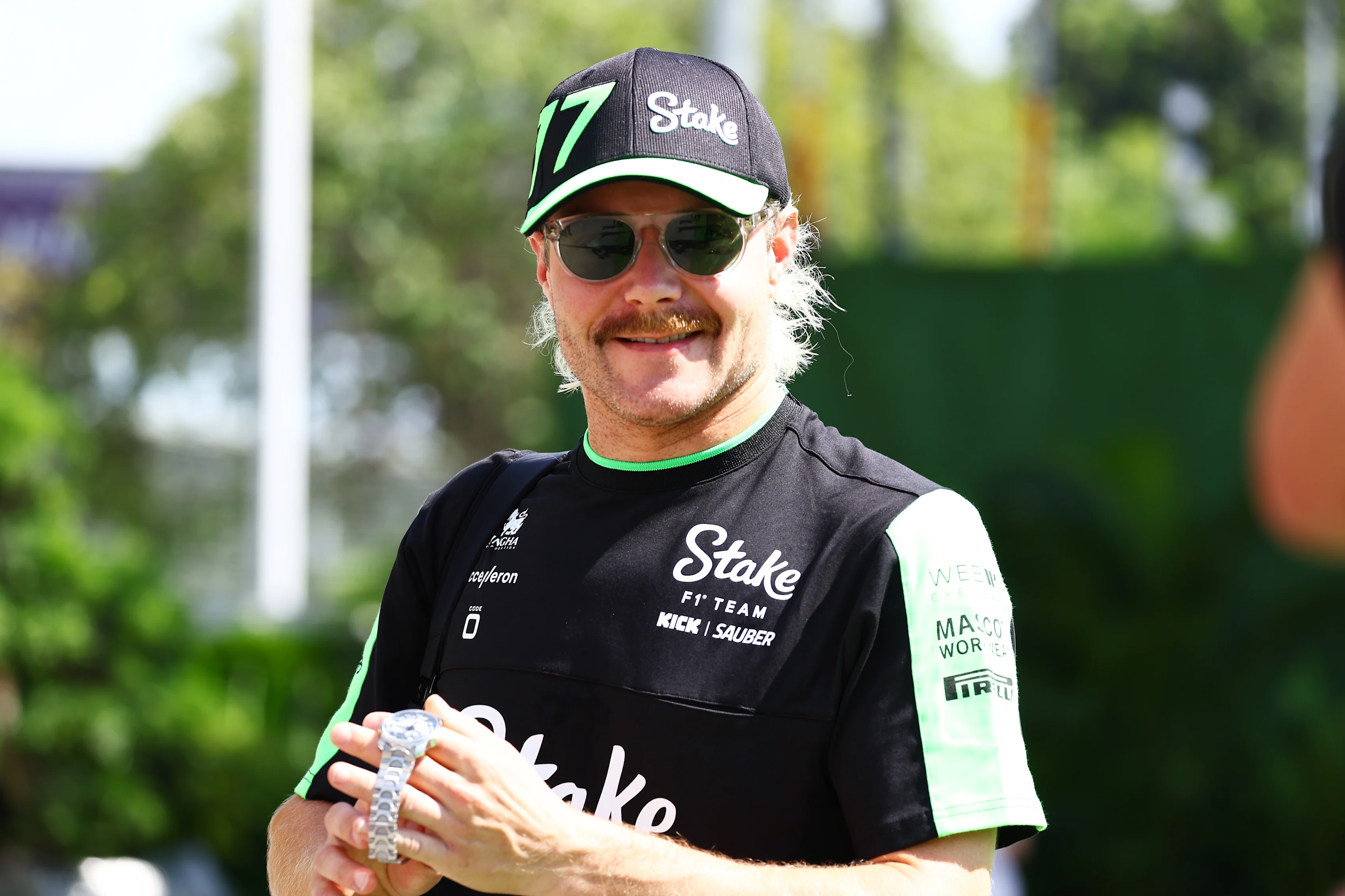 SINGAPORE, SINGAPORE - SEPTEMBER 22: Valtteri Bottas of Finland and Stake F1 Team Kick Sauber walks