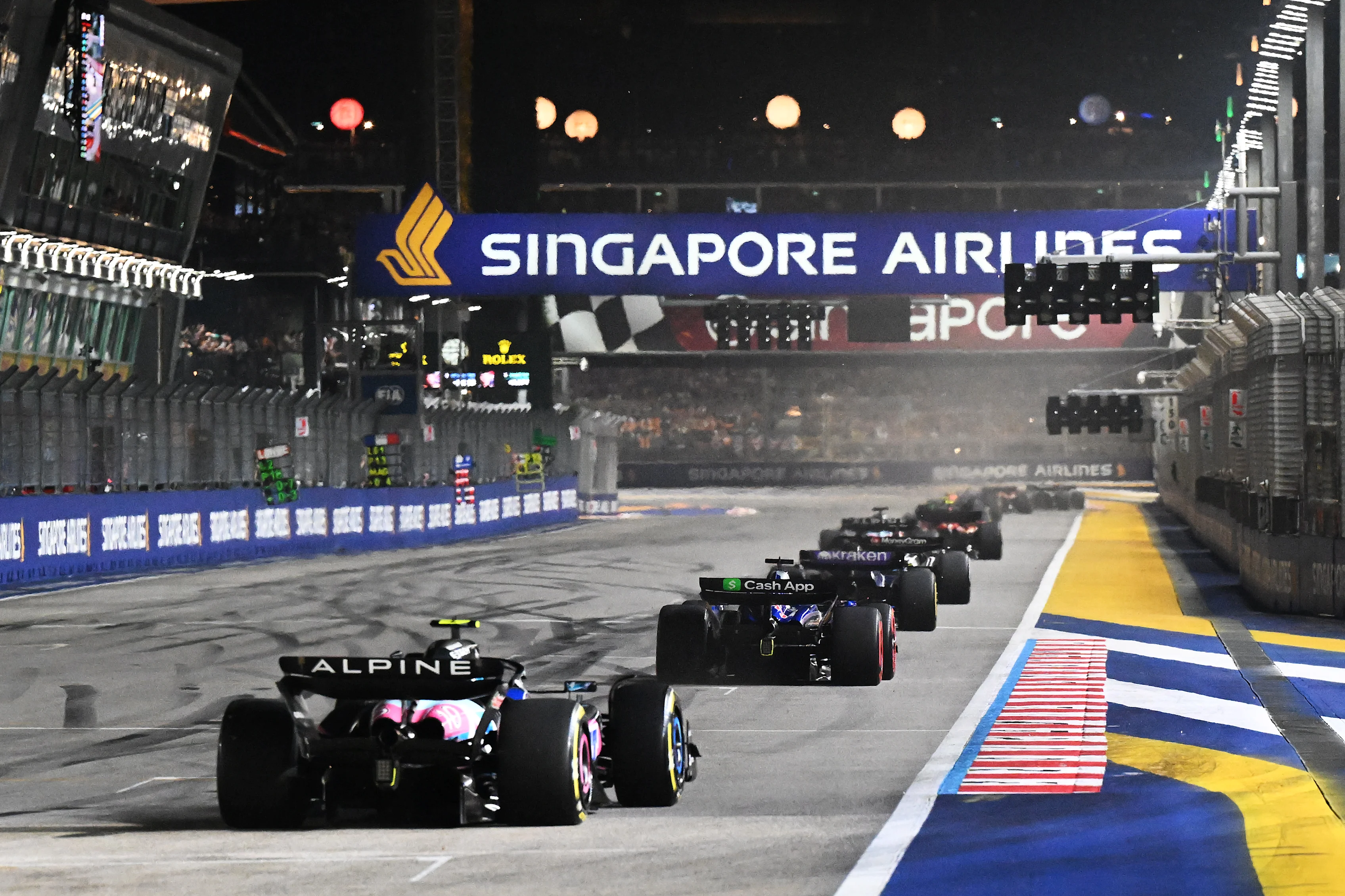 SINGAPORE, SINGAPORE - SEPTEMBER 22: Daniel Ricciardo of Australia driving the (3) Visa Cash App RB