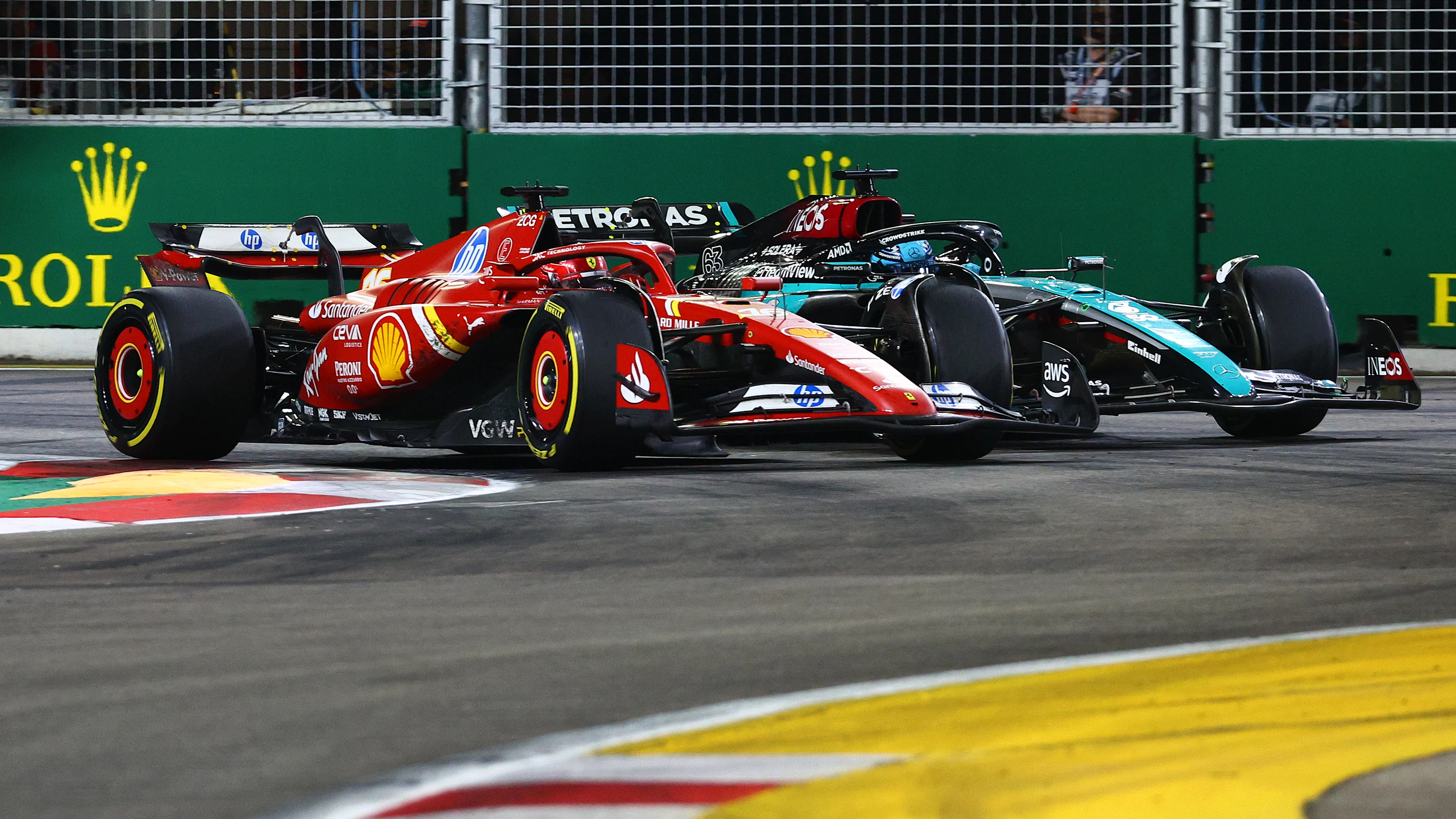 SINGAPORE, SINGAPORE - SEPTEMBER 22: Charles Leclerc of Monaco driving the (16) Ferrari SF-24 and George Russell of Great Britain driving the (63) Mercedes AMG Petronas F1 Team W15 battle for position during the F1 Grand Prix of Singapore at Marina Bay Street Circuit on September 22, 2024 in Singapore, Singapore. (Photo by Clive Rose - Formula 1/Formula 1 via Getty Images)
