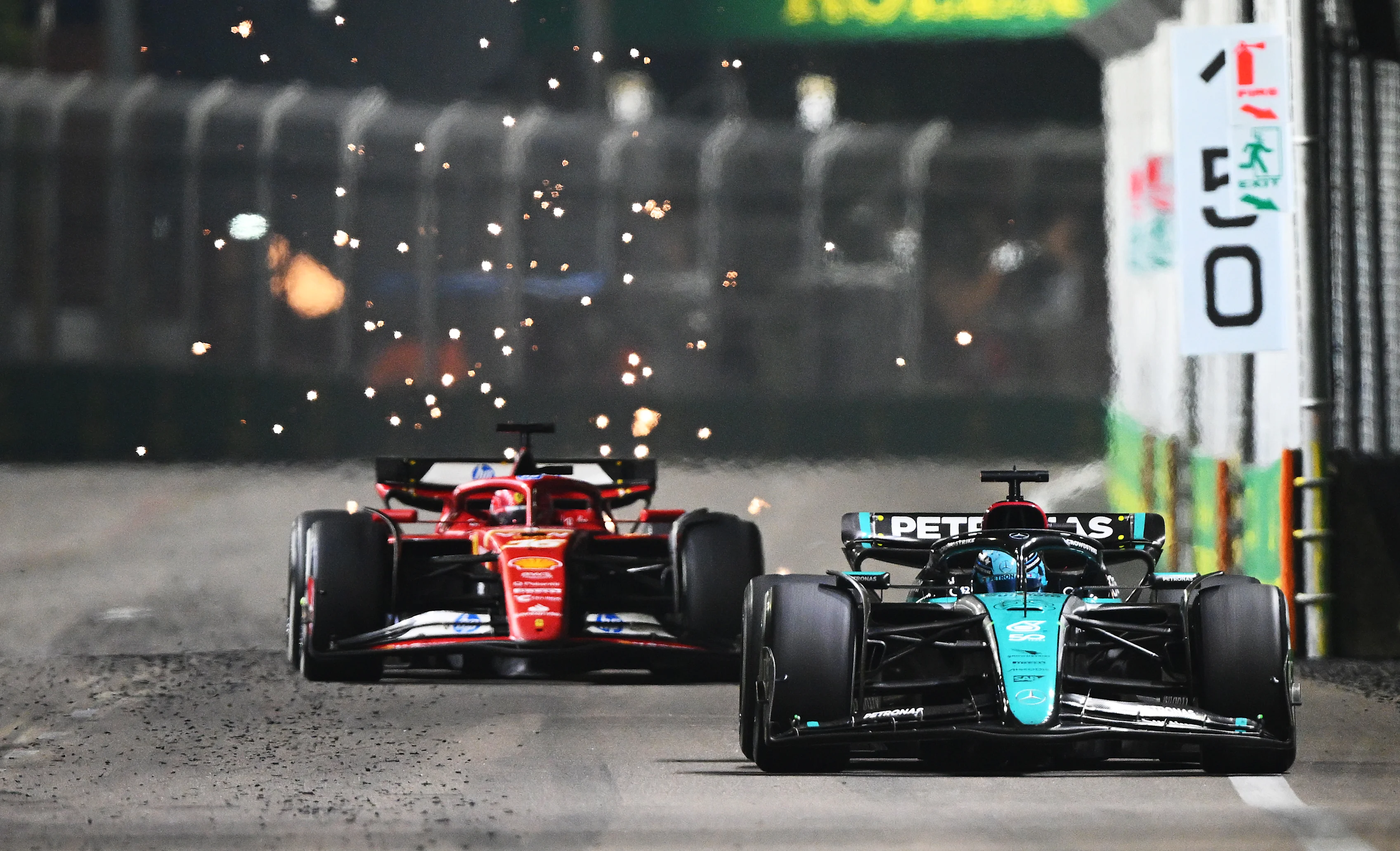 SINGAPORE, SINGAPORE - SEPTEMBER 22: George Russell of Great Britain driving the (63) Mercedes AMG