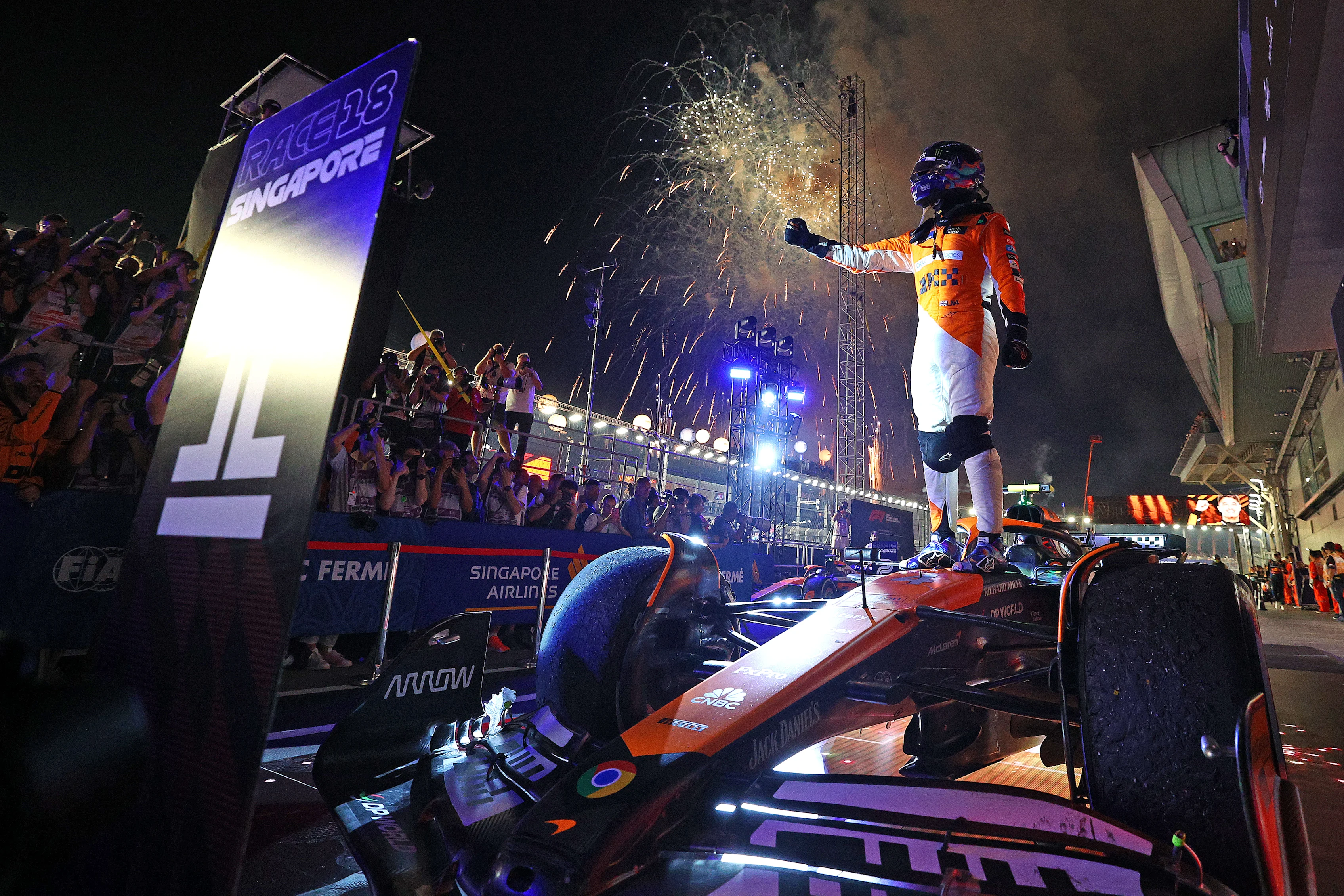 SINGAPORE, SINGAPORE - SEPTEMBER 22: Race winner Lando Norris of Great Britain and McLaren