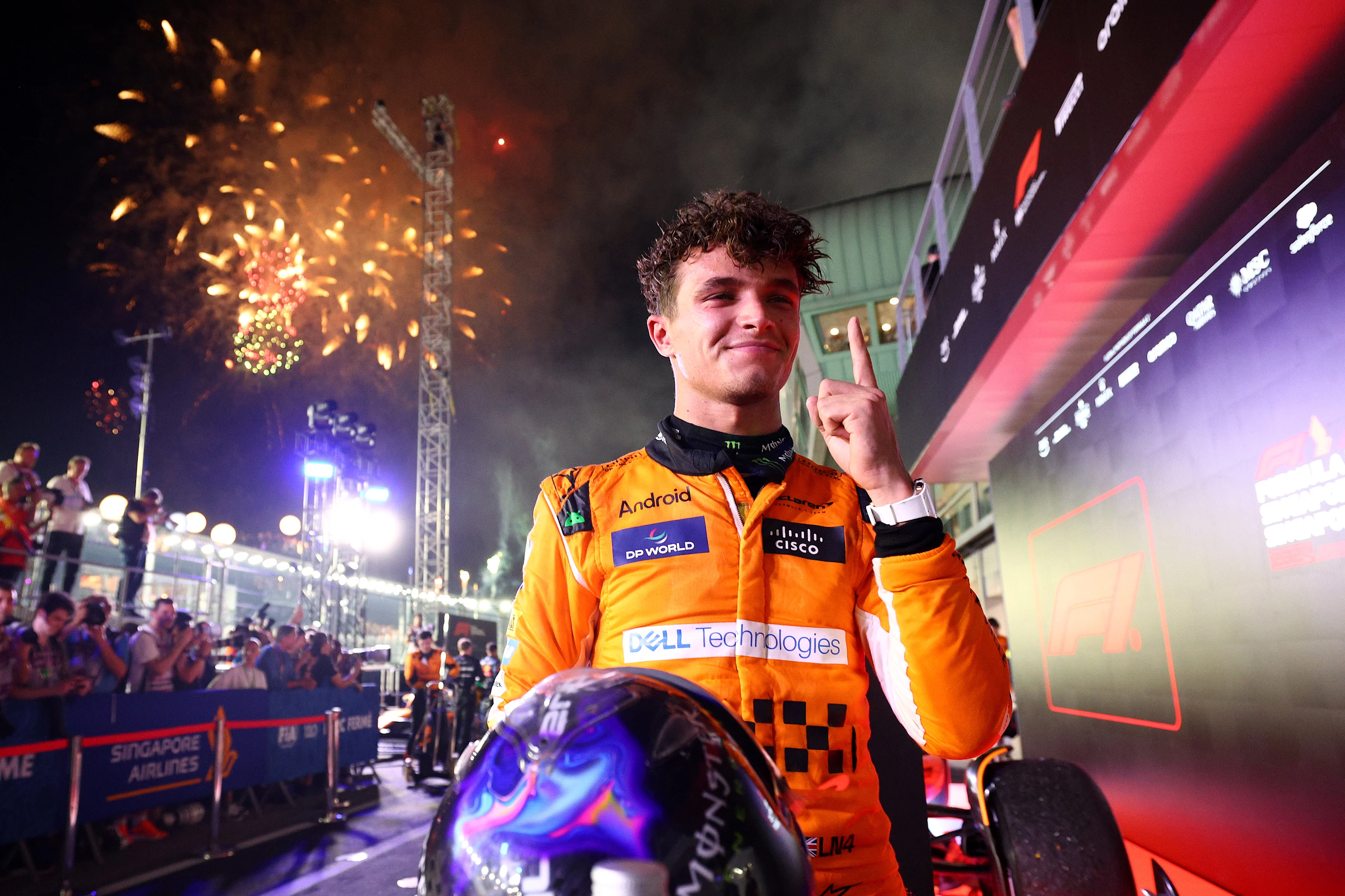 SINGAPORE, SINGAPORE - SEPTEMBER 22: Race winner Lando Norris of Great Britain and McLaren celebrates in parc ferme during the F1 Grand Prix of Singapore at Marina Bay Street Circuit on September 22, 2024 in Singapore, Singapore. (Photo by Clive Rose - Formula 1/Formula 1 via Getty Images)