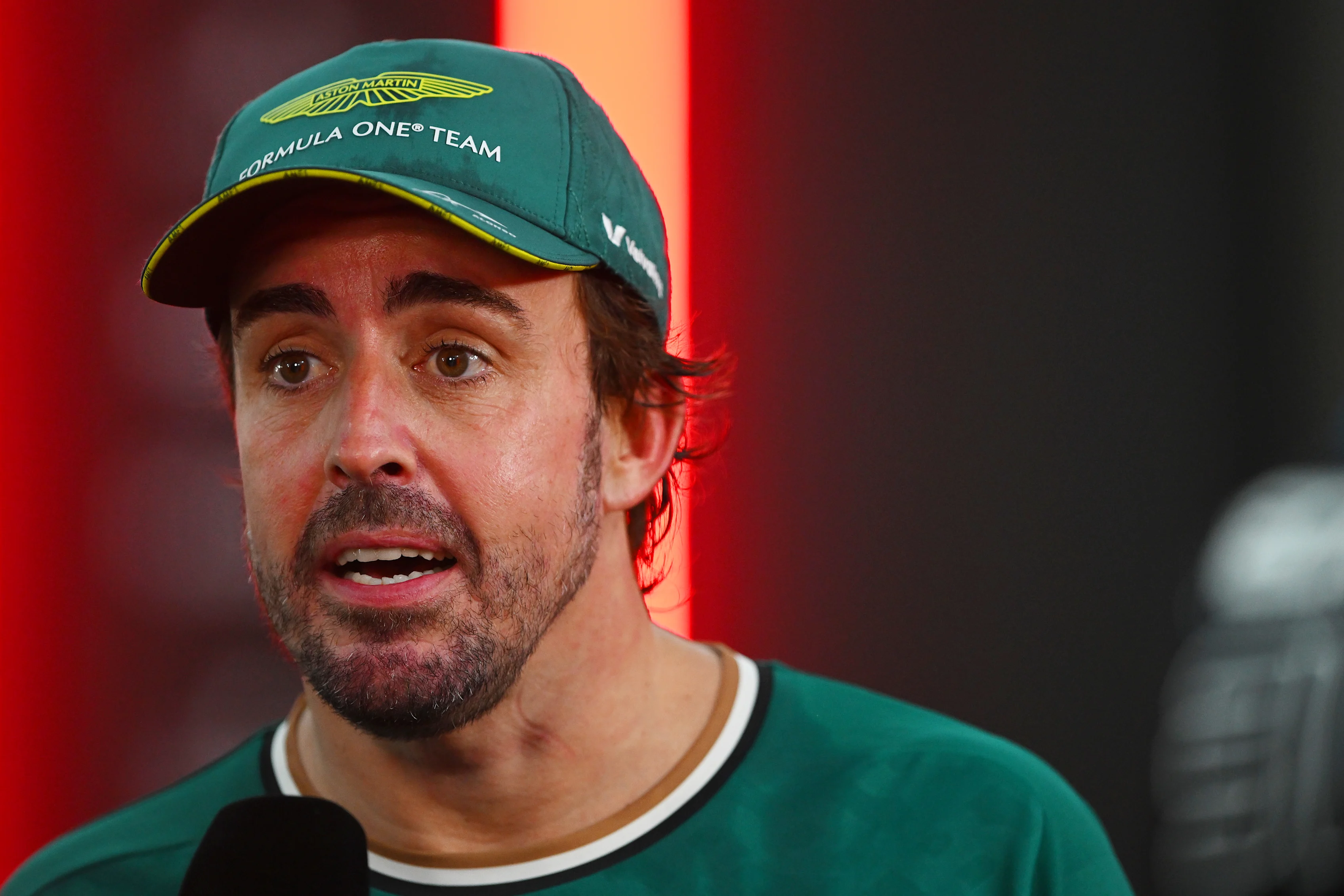 SINGAPORE, SINGAPORE - SEPTEMBER 22: 8th placed Fernando Alonso of Spain and Aston Martin F1 Team