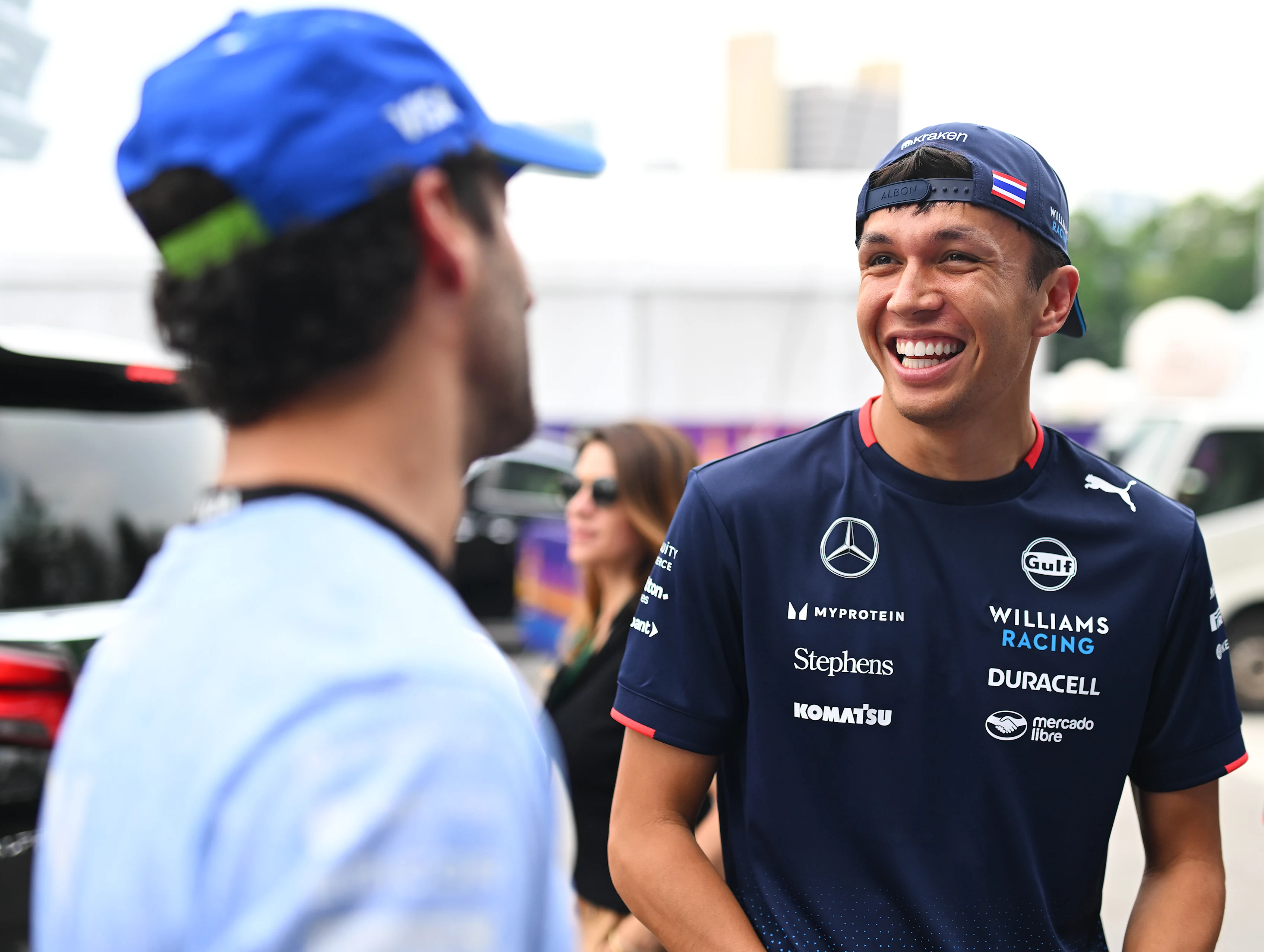 SINGAPORE, SINGAPORE - SEPTEMBER 20: Alexander Albon of Thailand and Williams talks with Daniel Ricciardo of Australia and Visa Cash App RB prior to practice ahead of the F1 Grand Prix of Singapore at Marina Bay Street Circuit on September 20, 2024 in Singapore, Singapore. (Photo by Rudy Carezzevoli/Getty Images)