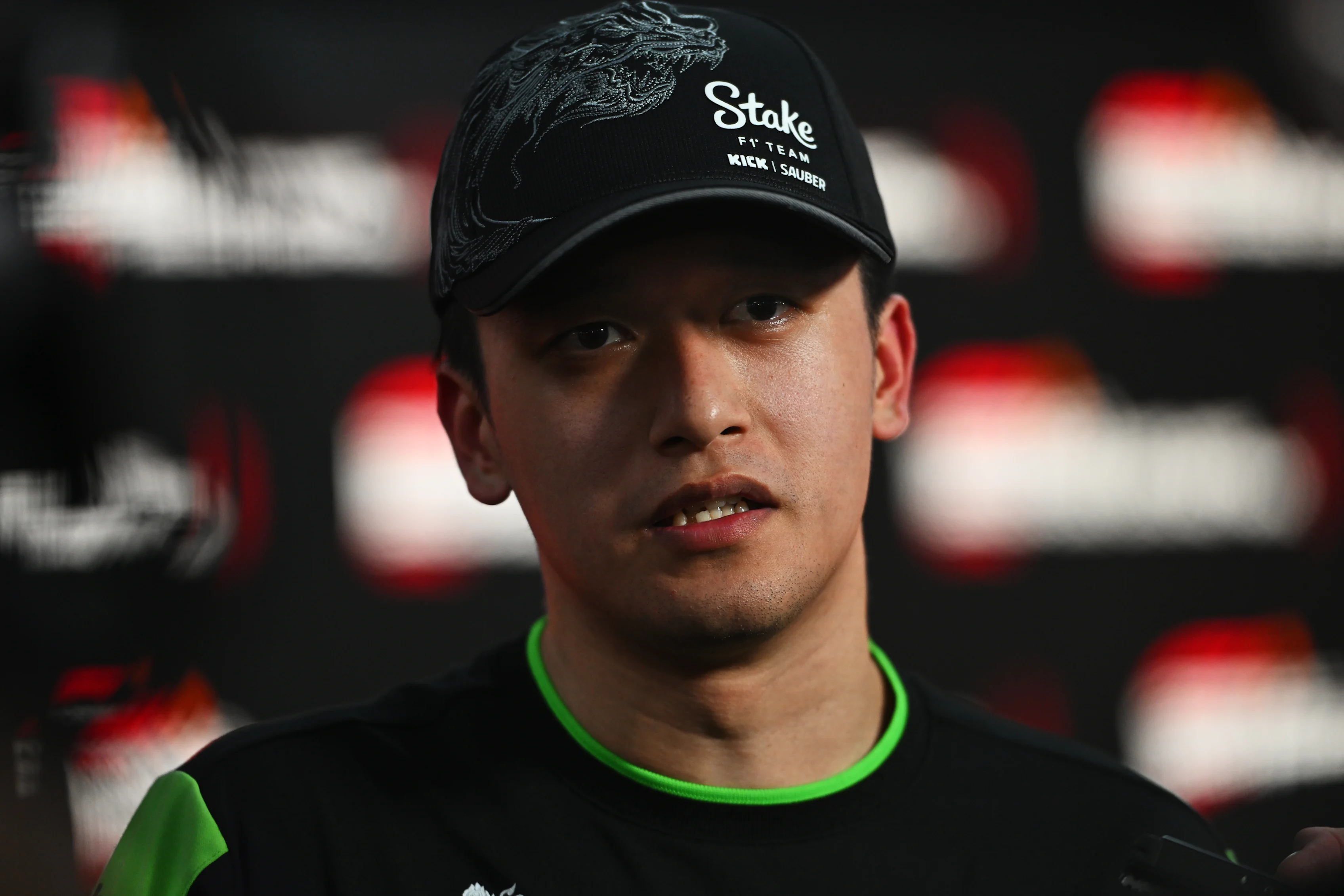 SINGAPORE, SINGAPORE - SEPTEMBER 20: Zhou Guanyu of China and Stake F1 Team Kick Sauber talks to the media following practice ahead of the Grand Prix of Singapore at Marina Bay Street Circuit on September 20, 2024. (Photo by Rudy Carezzevoli/Getty Images)