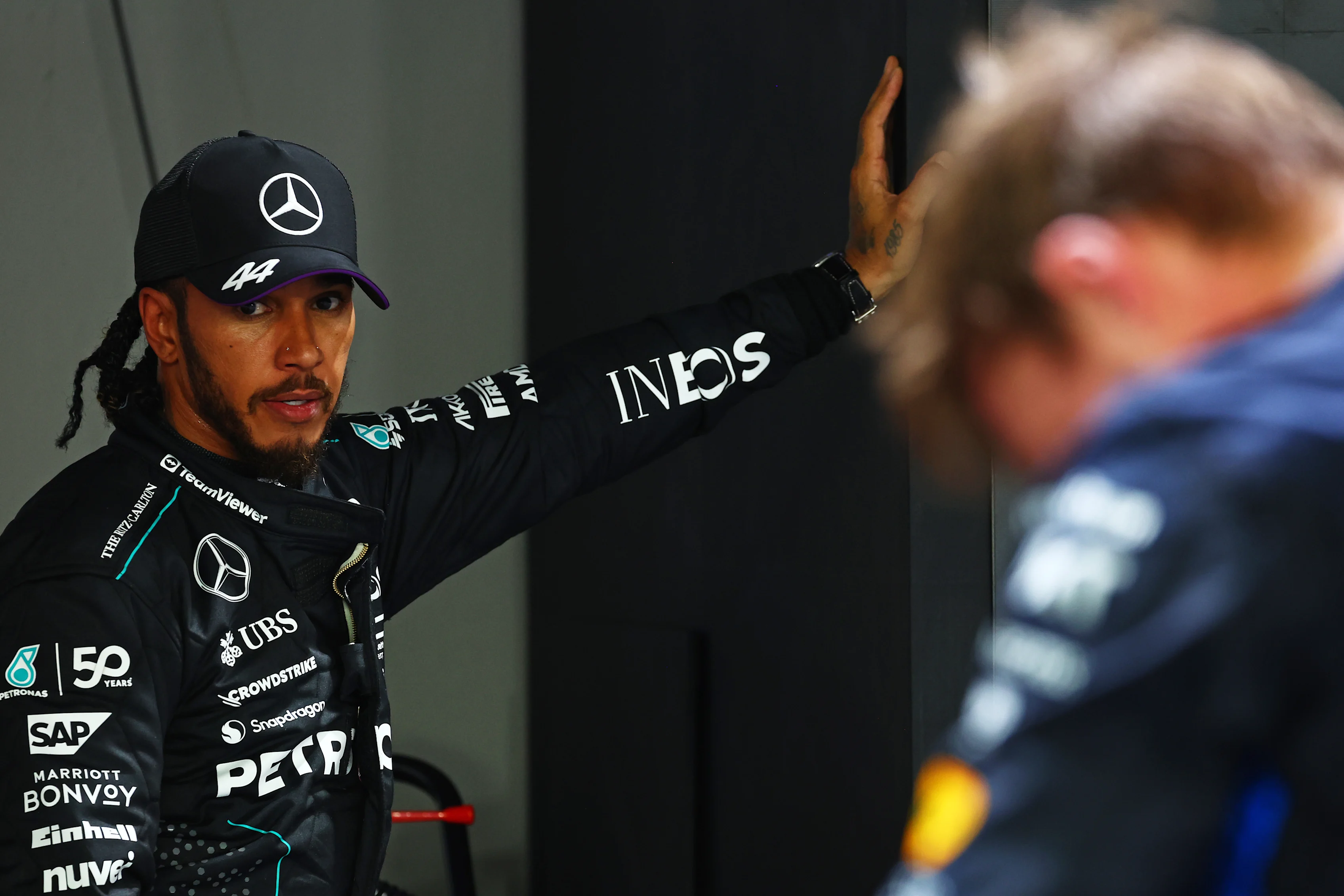 SINGAPORE, SINGAPORE - SEPTEMBER 21: Third placed qualifier Lewis Hamilton of Great Britain and Mercedes looks on in parc ferme during qualifying ahead of the F1 Grand Prix of Singapore at Marina Bay Street Circuit on September 21, 2024 in Singapore, Singapore. (Photo by Mark Thompson/Getty Images)