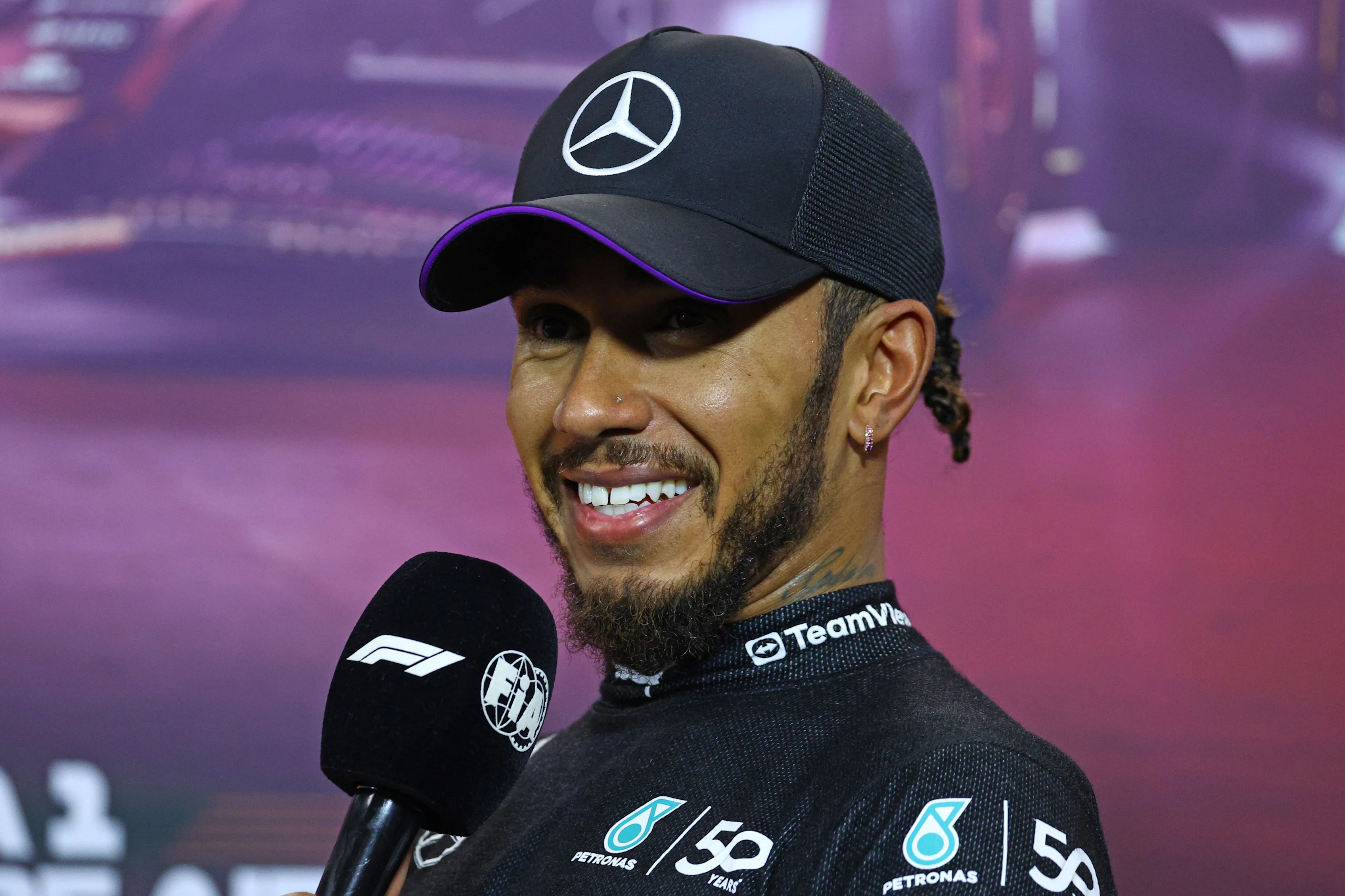 SINGAPORE, SINGAPORE - SEPTEMBER 21: Third placed qualifier Lewis Hamilton of Great Britain and