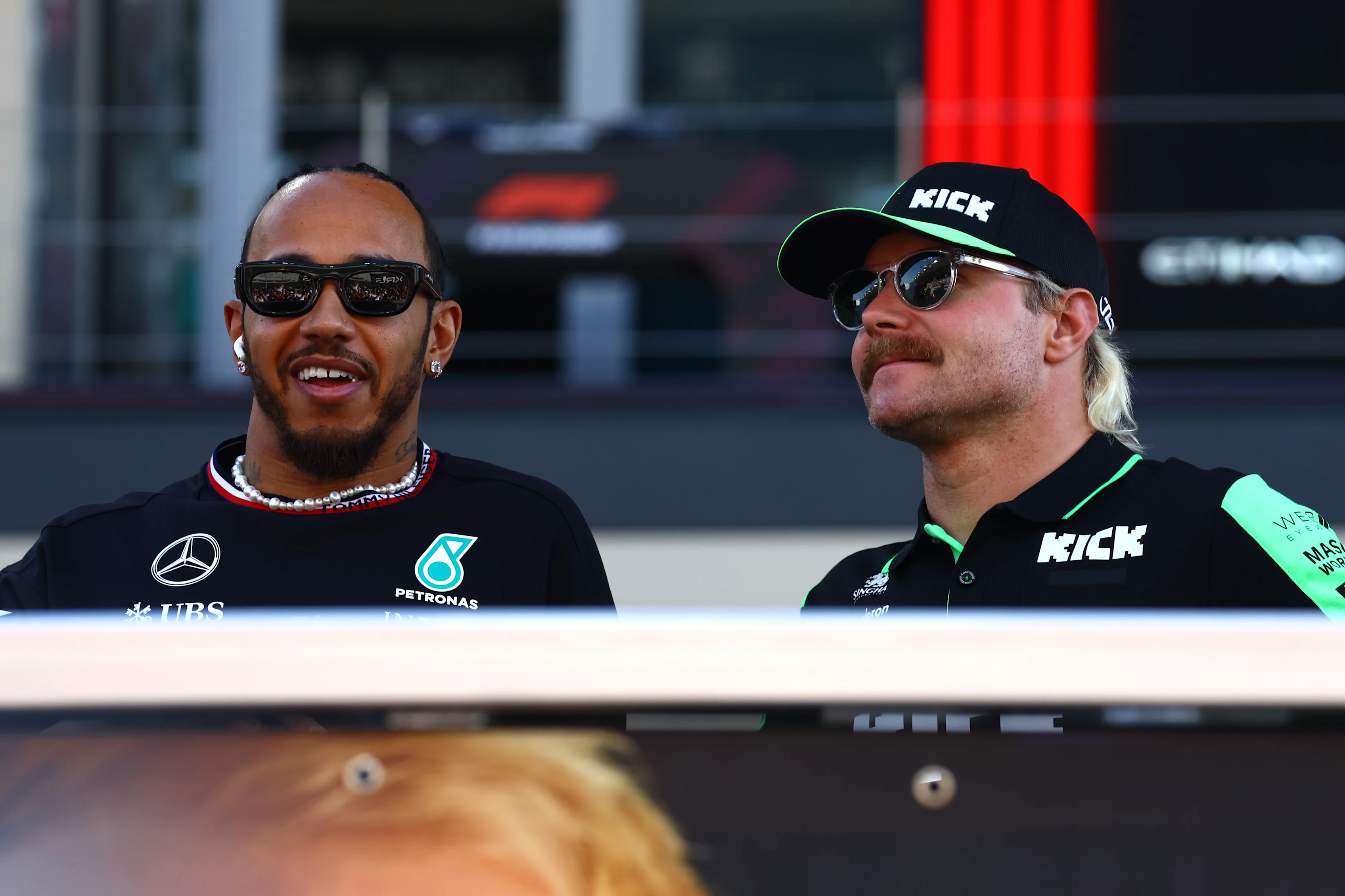 ABU DHABI, UNITED ARAB EMIRATES - DECEMBER 08: Lewis Hamilton of Great Britain and Mercedes and Valtteri Bottas of Finland and Stake F1 Team Kick Sauber talk on the drivers parade prior to the F1 Grand Prix of Abu Dhabi at Yas Marina Circuit on December 08, 2024 in Abu Dhabi, United Arab Emirates. (Photo by Mark Thompson/Getty Images)