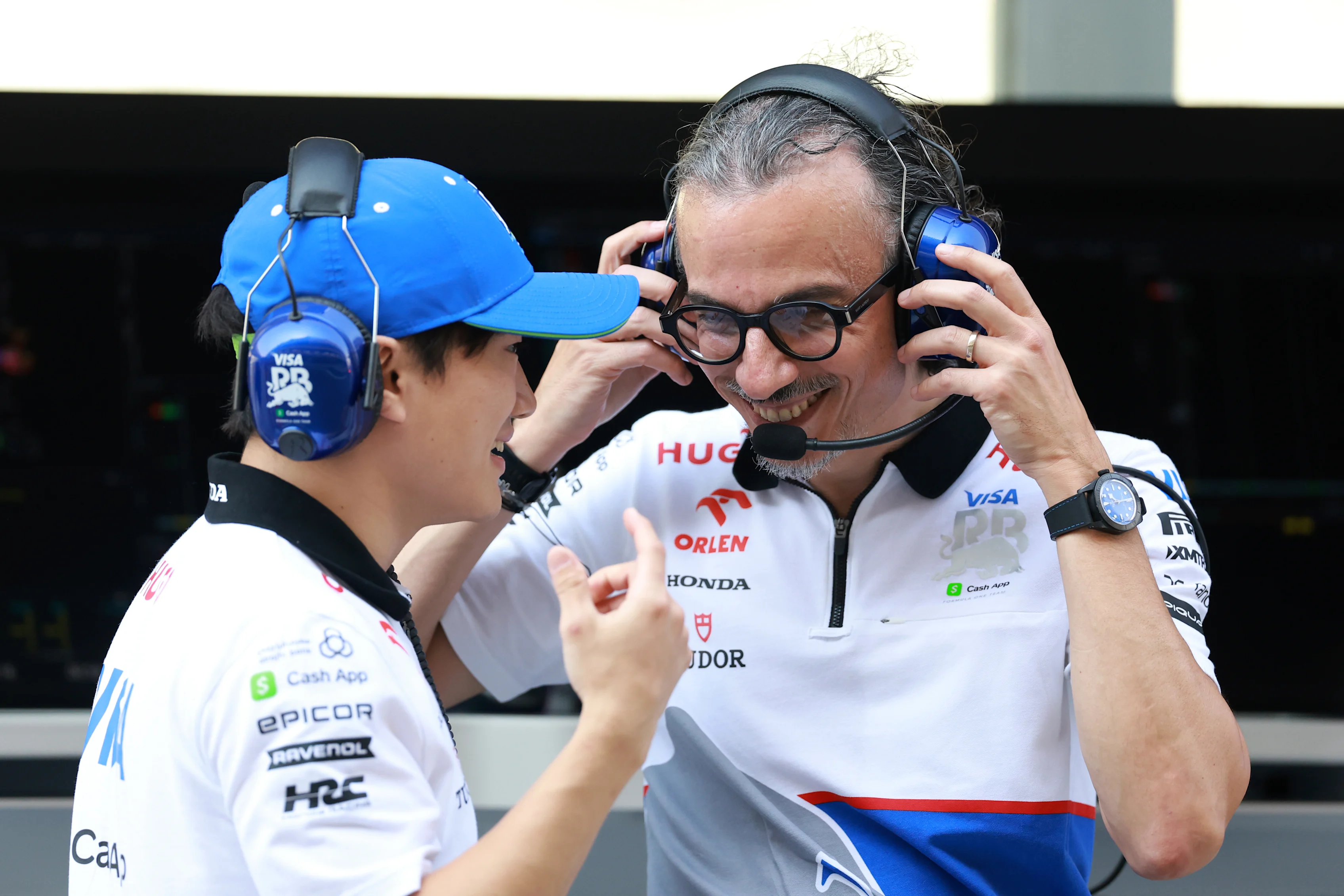 ABU DHABI, UNITED ARAB EMIRATES - DECEMBER 06: Yuki Tsunoda of Japan and Visa Cash App RB talks with Laurent Mekies, Team Principal of Visa Cash App RB on the pitwall during practice ahead of the F1 Grand Prix of Abu Dhabi at Yas Marina Circuit on December 06, 2024 in Abu Dhabi, United Arab Emirates. (Photo by Bryn Lennon - Formula 1/Formula 1 via Getty Images)