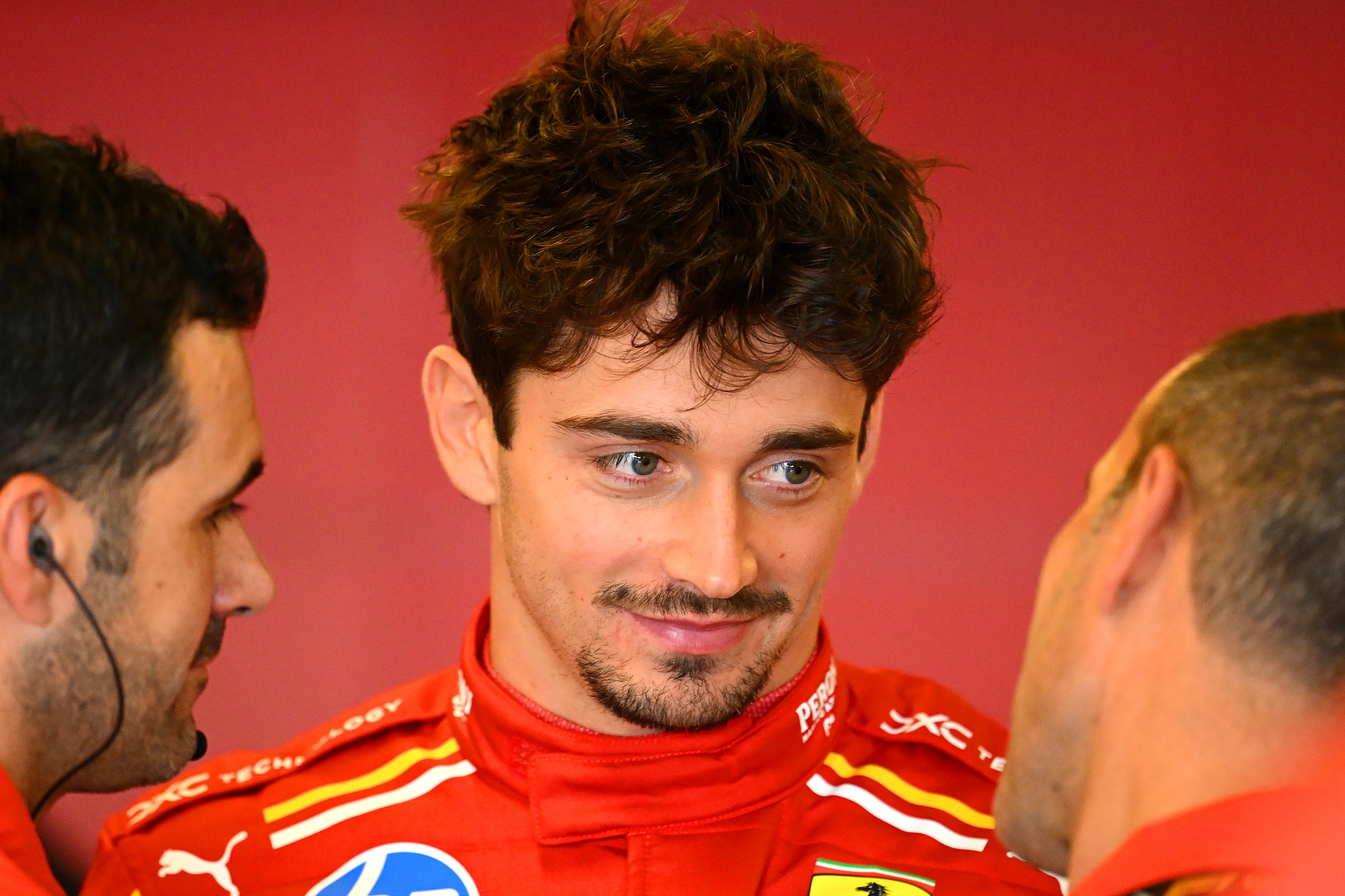 Charles Leclerc of Monaco and Ferrari talks with his team in the garage during practice ahead of the F1 Grand Prix of Abu Dhabi at Yas Marina Circuit on December 06, 2024 in Abu Dhabi, United Arab Emirates. (Photo by Clive Mason/Getty Images)