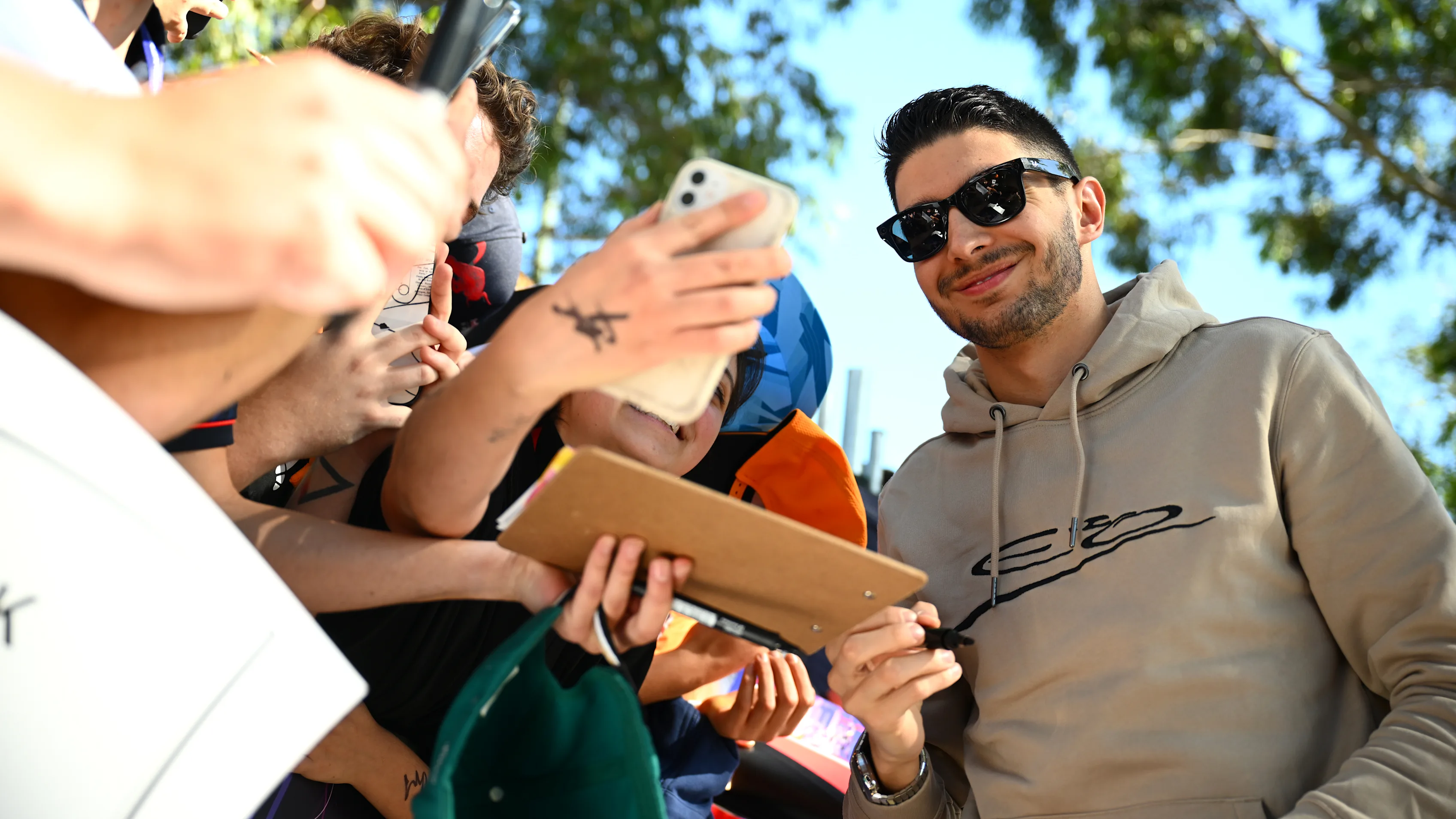 MELBOURNE, AUSTRALIA - MARCH 21: Esteban Ocon of France and Alpine F1 greets fans on the Melbourne