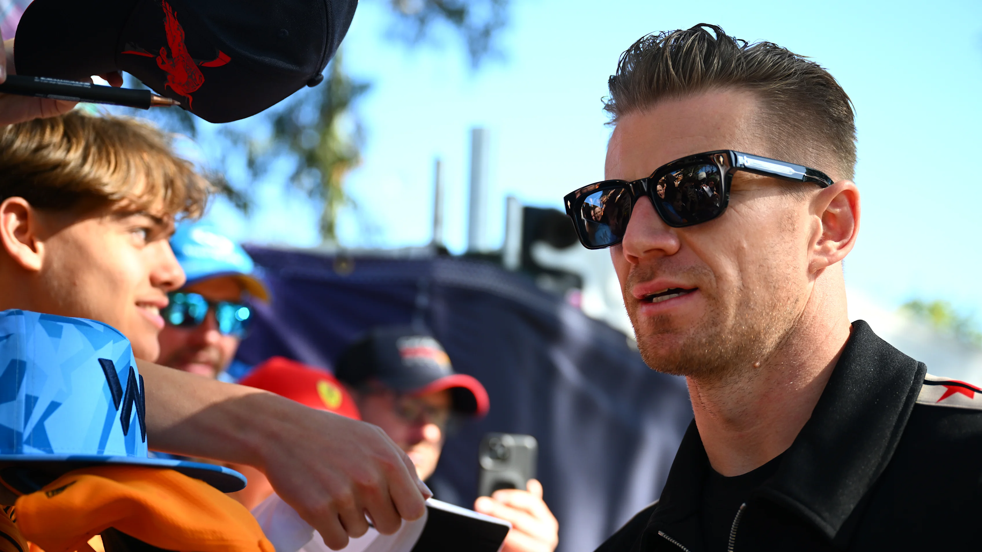 MELBOURNE, AUSTRALIA - MARCH 21: Nico Hulkenberg of Germany and Haas F1 greets fans on the