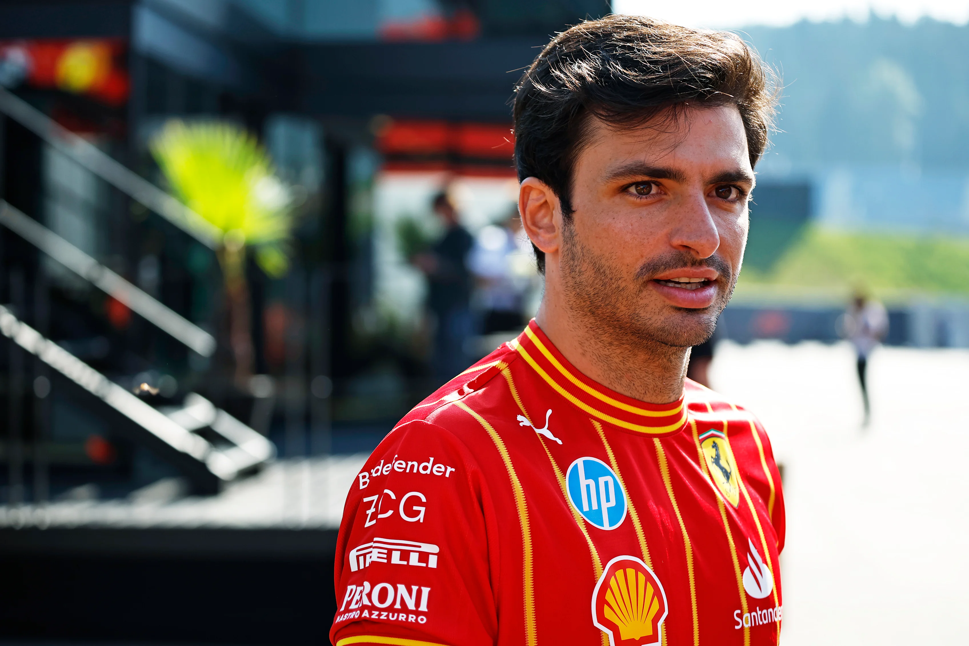 SPIELBERG, AUSTRIA - JUNE 29: Carlos Sainz of Spain and Ferrari walks in the Paddock prior to the