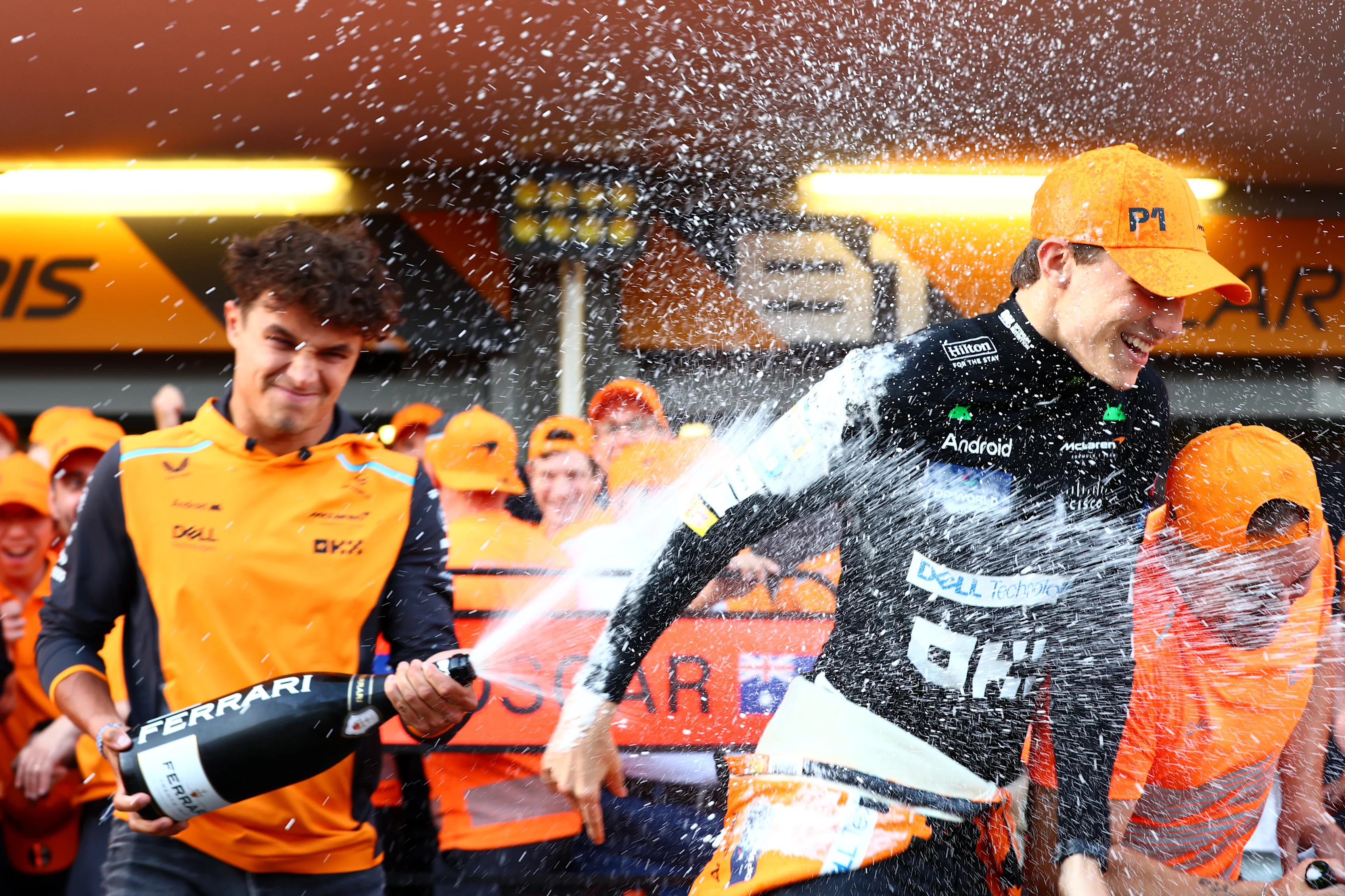 BAKU, AZERBAIJAN - SEPTEMBER 15: Race winner Oscar Piastri of Australia and McLaren and 4th placed Lando Norris of Great Britain and McLaren celebrate with their team in the Pitlane after the F1 Grand Prix of Azerbaijan at Baku City Circuit on September 15, 2024 in Baku, Azerbaijan. (Photo by Clive Rose - Formula 1/Formula 1 via Getty Images)