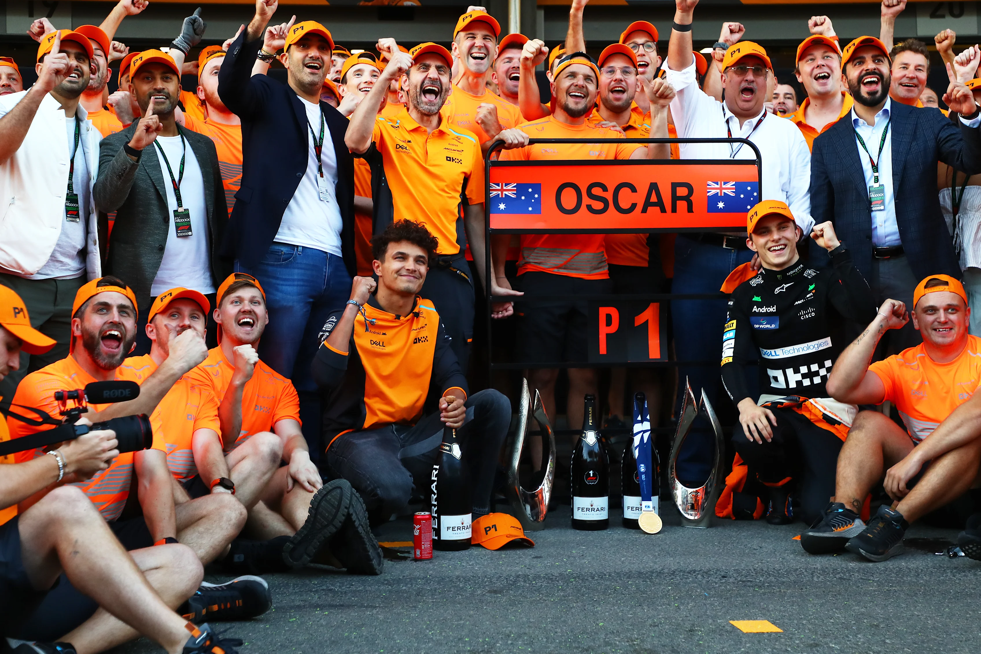 BAKU, AZERBAIJAN - SEPTEMBER 15: Race winner Oscar Piastri of Australia and McLaren and 4th placed Lando Norris celebrate with their team after the F1 Grand Prix of Azerbaijan. (Photo by Peter Fox - Formula 1/Formula 1 via Getty Images)