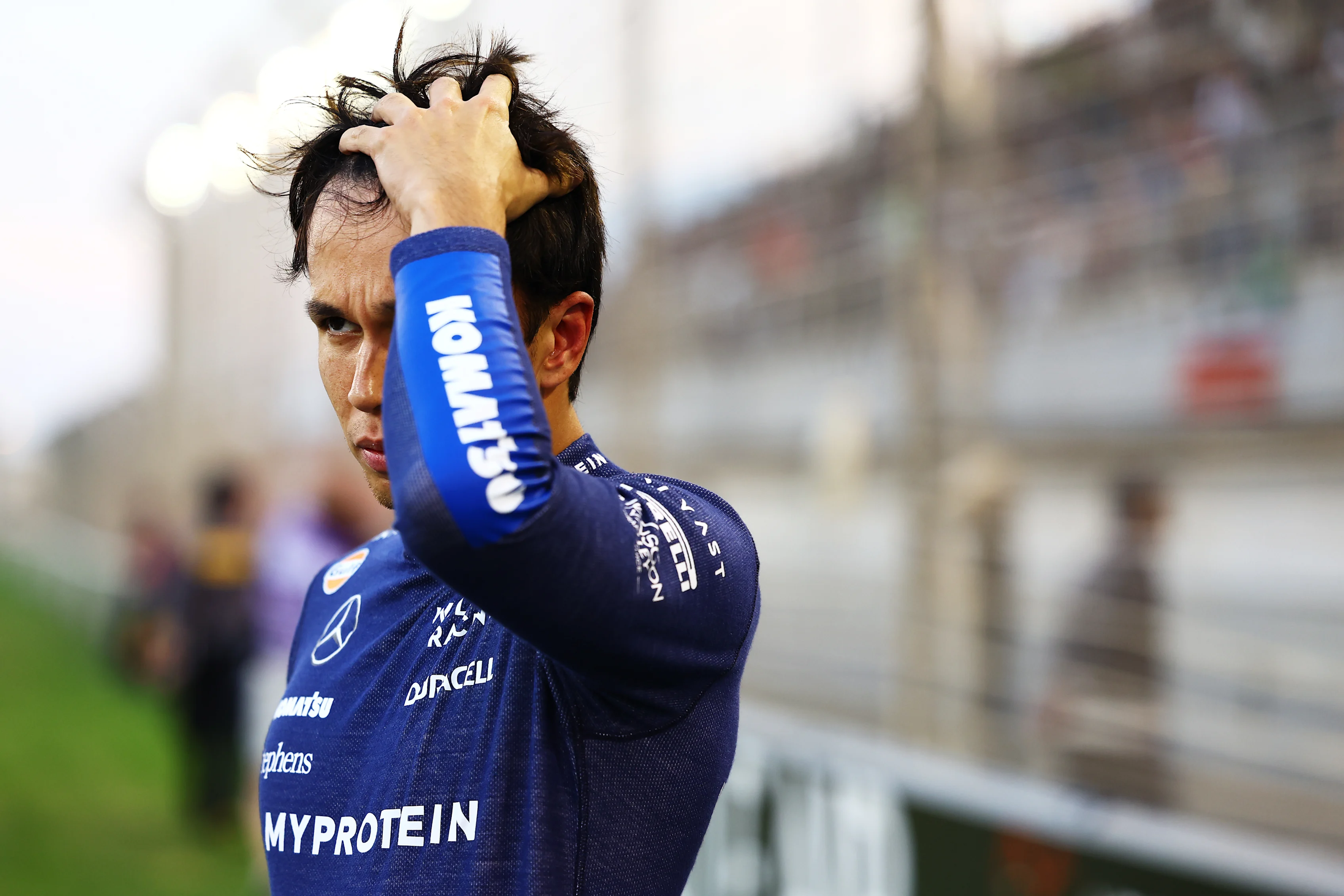 BAHRAIN, BAHRAIN - MARCH 02: Alexander Albon of Thailand and Williams prepares to drive on the grid prior to the F1 Grand Prix of Bahrain at Bahrain International Circuit on March 02, 2024 in Bahrain, Bahrain. (Photo by Mark Thompson/Getty Images)