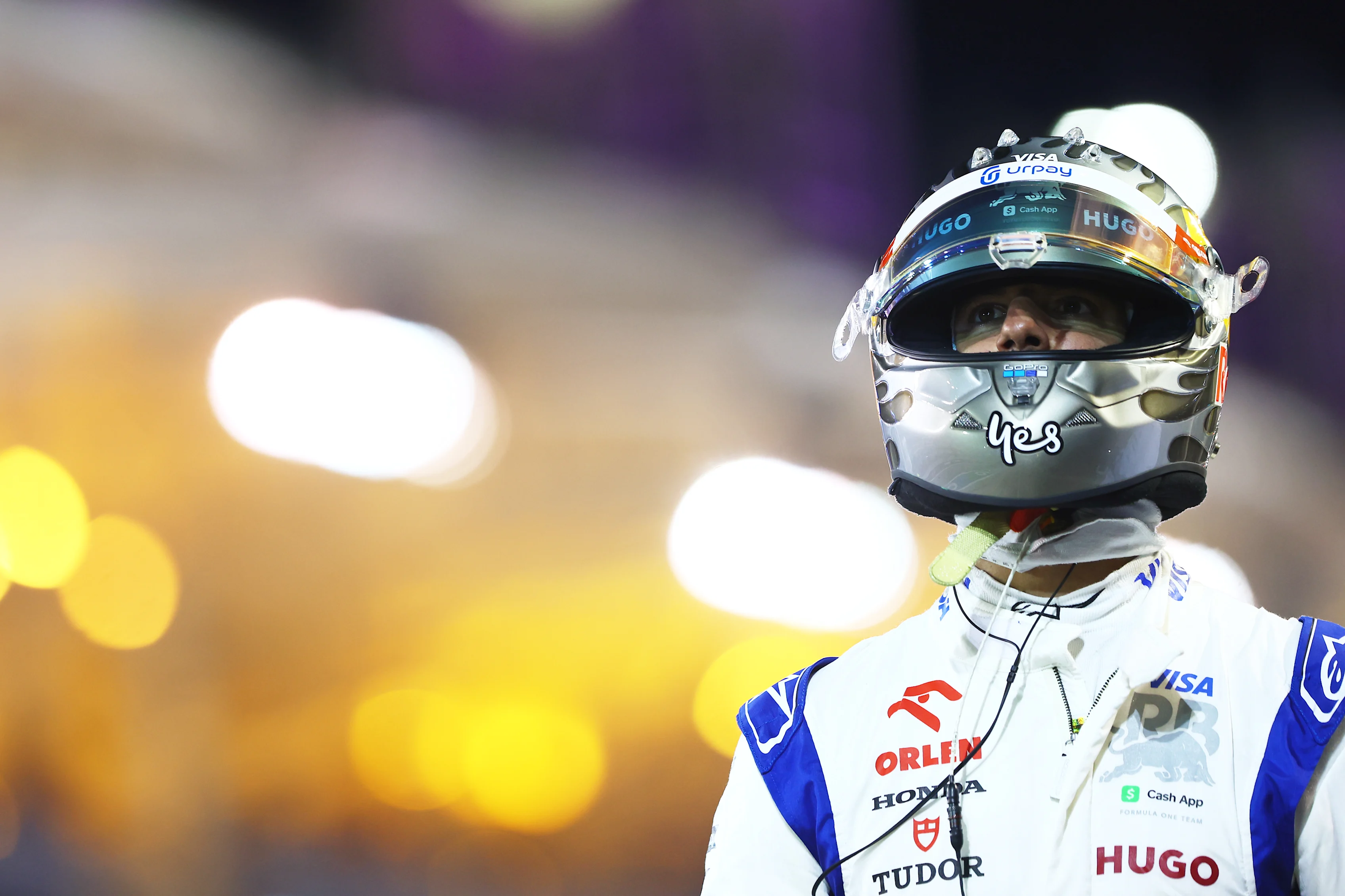 BAHRAIN, BAHRAIN - MARCH 01: 13th placed qualifier Daniel Ricciardo of Australia and Visa Cash App RB walks in the Pitlane during qualifying ahead of the F1 Grand Prix of Bahrain at Bahrain International Circuit on March 01, 2024 in Bahrain, Bahrain. (Photo by Mark Thompson/Getty Images)