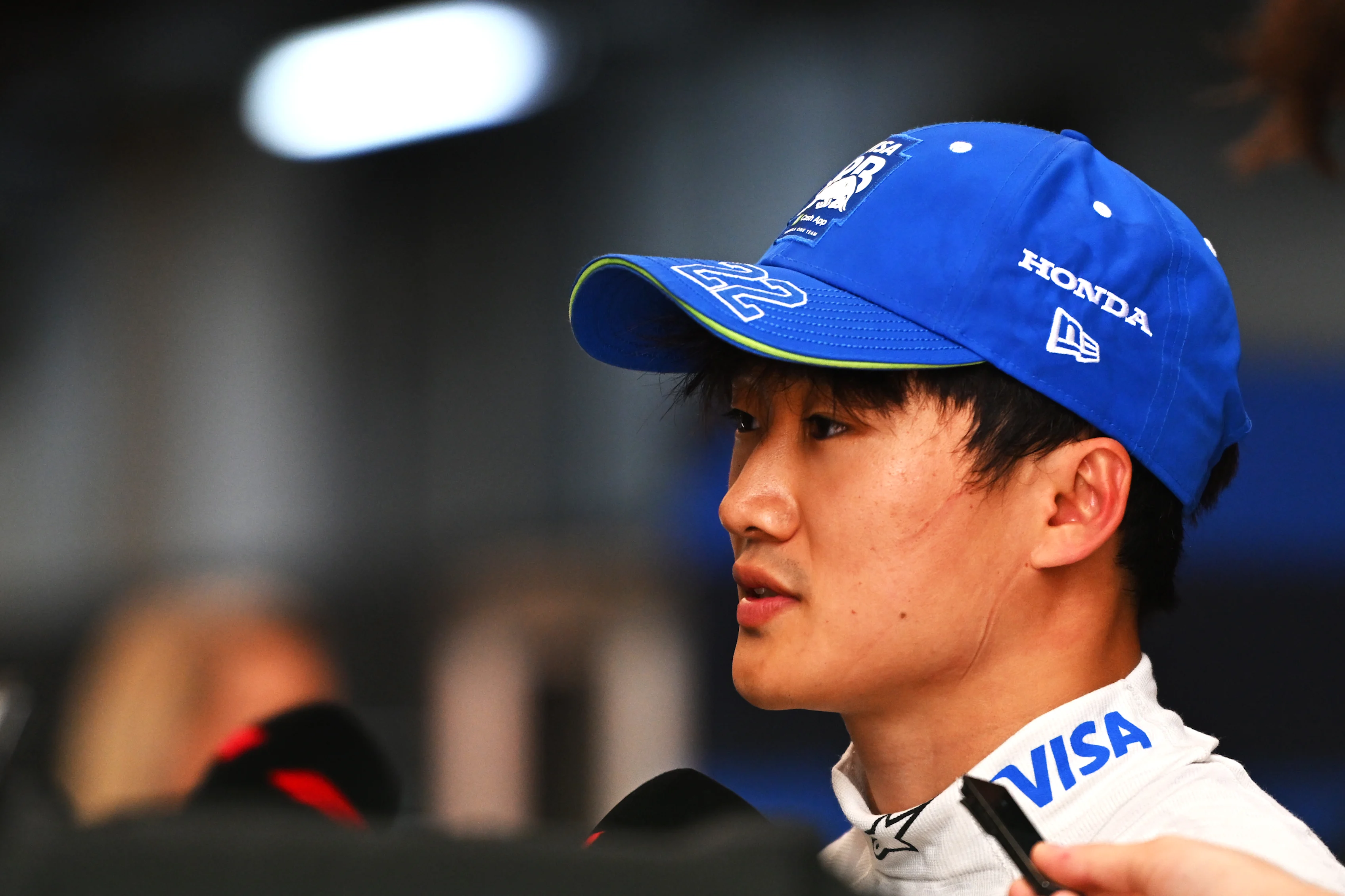 SAO PAULO, BRAZIL - NOVEMBER 01: 18th placed qualifier Yuki Tsunoda of Japan and Visa Cash App RB talks to the media in the Paddock during Sprint Qualifying ahead of the F1 Grand Prix of Brazil at Autodromo Jose Carlos Pace on November 01, 2024 in Sao Paulo, Brazil. (Photo by Rudy Carezzevoli/Getty Images)