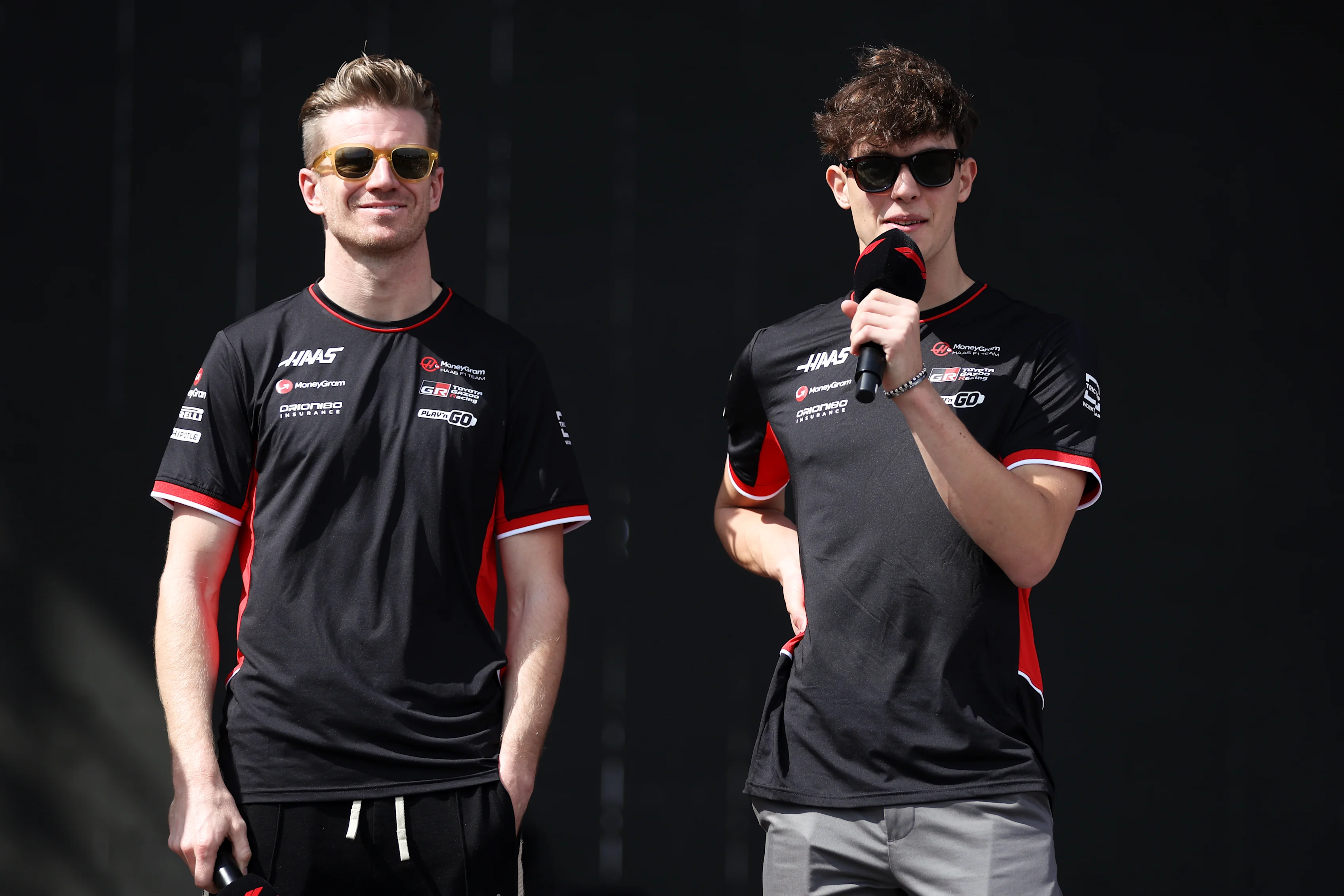 SAO PAULO, BRAZIL - NOVEMBER 02: Nico Hulkenberg and Oliver Bearman talk to the crowd ahead of the F1 Grand Prix of Brazil at Autodromo Jose Carlos Pace on November 02, 2024 in Sao Paulo, Brazil. (Photo by Lars Baron - Formula 1/Formula 1 via Getty Images)