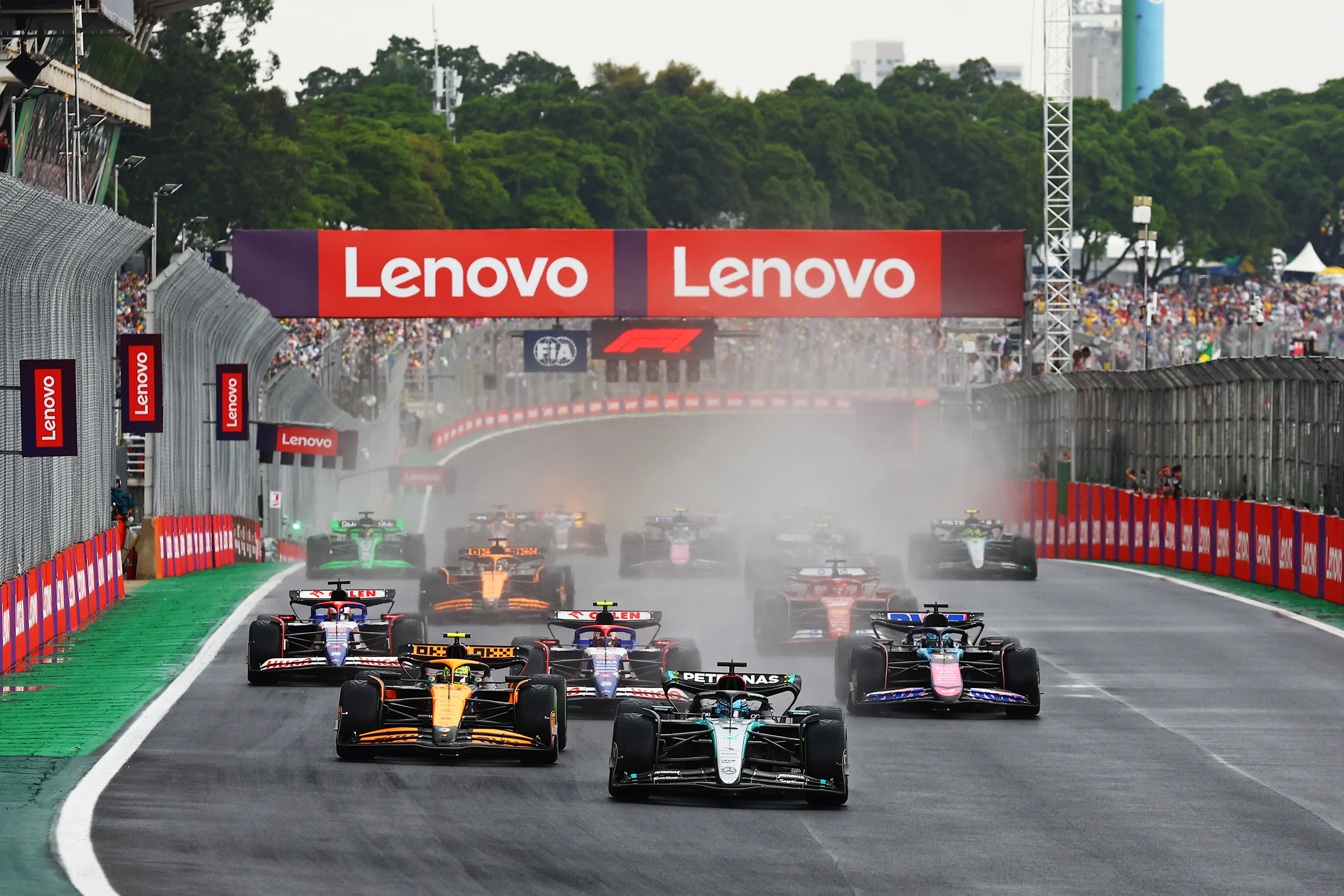 SAO PAULO, BRAZIL - NOVEMBER 03: George Russell leads Lando Norris and the rest of the field into turn 1 during the F1 Grand Prix of Brazil at Autodromo Jose Carlos Pace on November 03, 2024 in Sao Paulo, Brazil. (Photo by Mark Thompson/Getty Images)