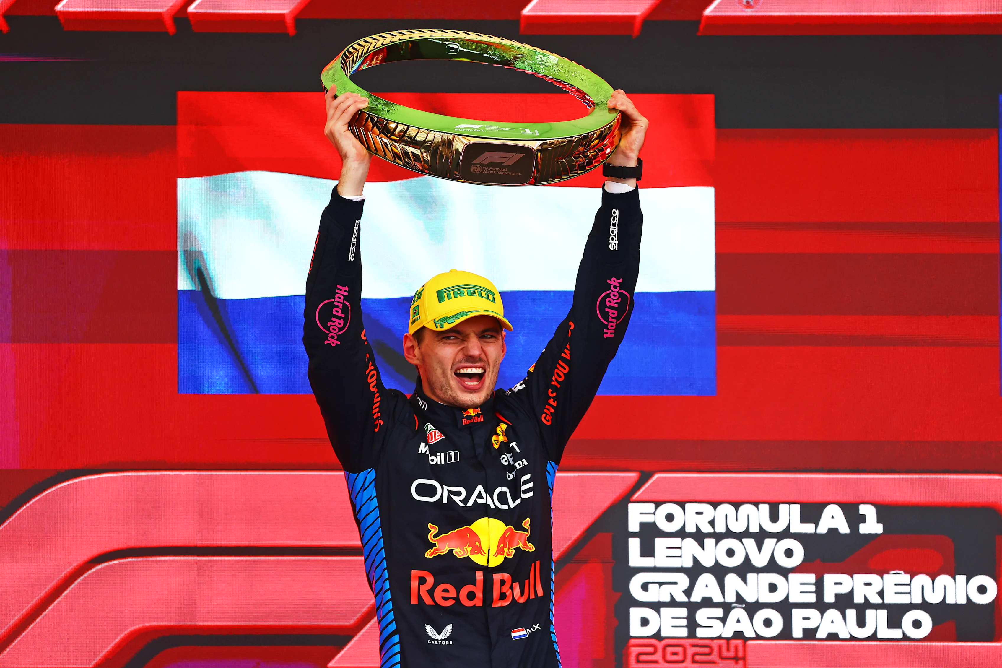SAO PAULO, BRAZIL - NOVEMBER 03: Race winner Max Verstappen celebrates on the podium after the F1 Grand Prix of Brazil at Autodromo Jose Carlos Pace on November 03, 2024 in Sao Paulo, Brazil. (Photo by Mark Thompson/Getty Images)