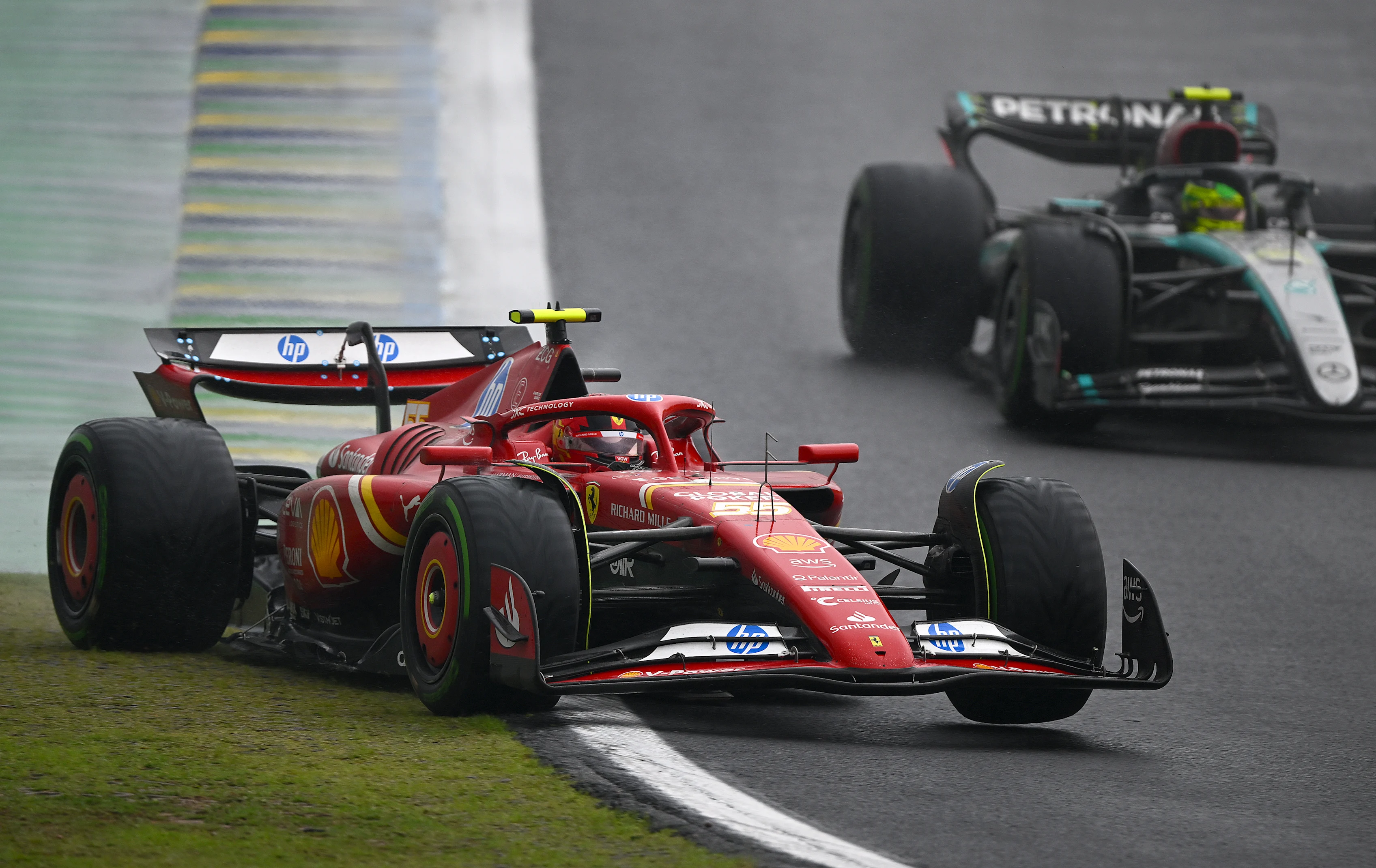 SAO PAULO, BRAZIL - NOVEMBER 03: Carlos Sainz driving the Ferrari SF-24 rejoins the track after running wide during the F1 Grand Prix of Brazil at Autodromo Jose Carlos Pace on November 03, 2024 in Sao Paulo, Brazil. (Photo by Clive Mason/Getty Images)