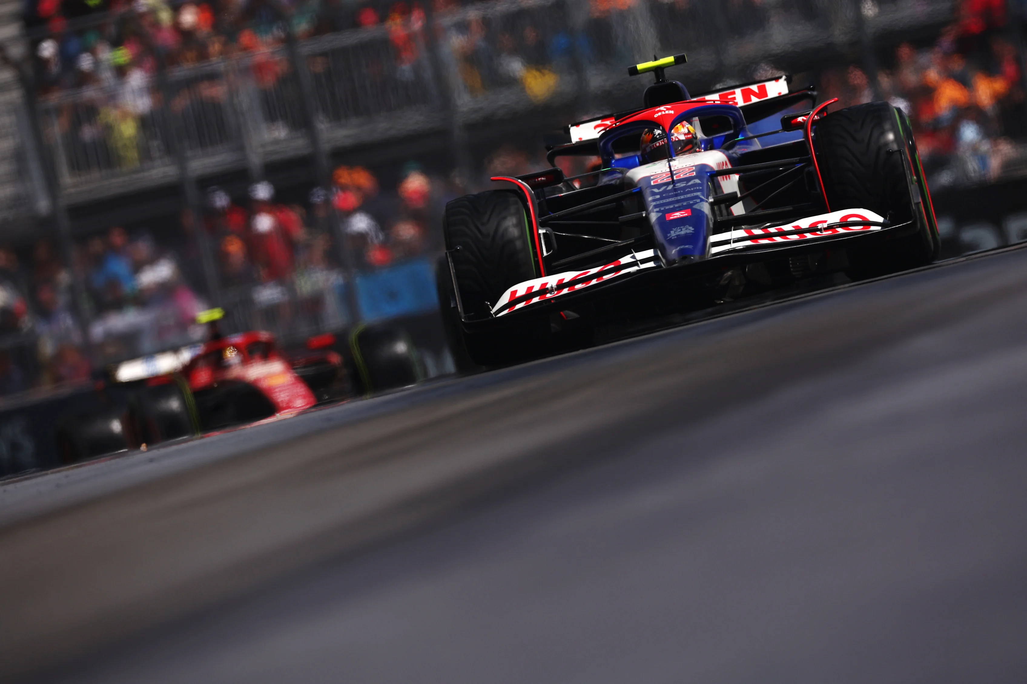 MONTREAL, QUEBEC - JUNE 09: Yuki Tsunoda of Japan driving the (22) Visa Cash App RB VCARB 01 leads Carlos Sainz of Spain driving (55) the Ferrari SF-24 on track  during the F1 Grand Prix of Canada at Circuit Gilles Villeneuve on June 09, 2024 in Montreal, Quebec. (Photo by Jared C. Tilton - Formula 1/Formula 1 via Getty Images)