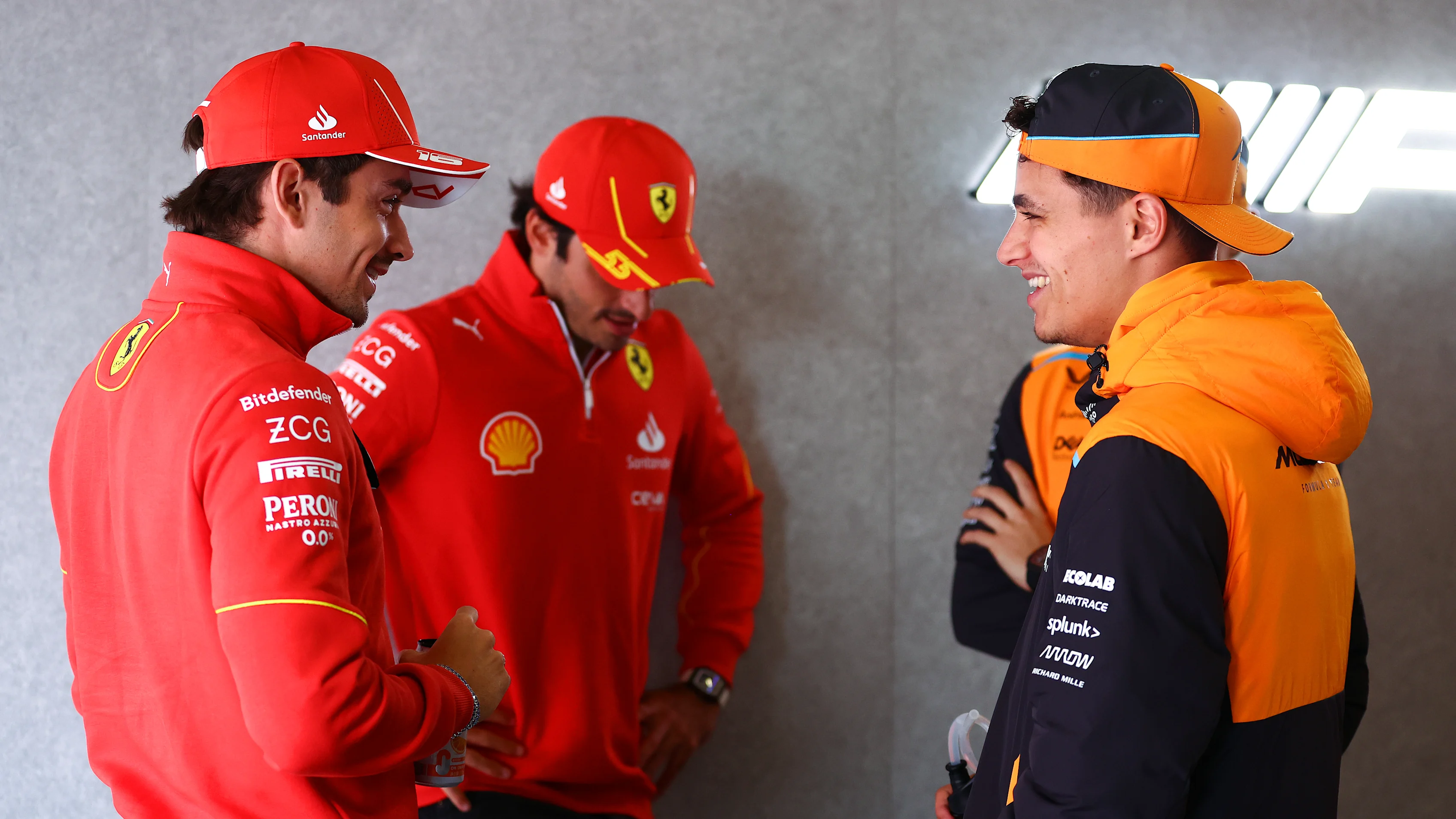 SHANGHAI, CHINA - APRIL 21: Lando Norris of Great Britain and McLaren, Charles Leclerc of Monaco and Ferrari and Carlos Sainz of Spain and Ferrari talk during the drivers parade prior to the F1 Grand Prix of China at Shanghai International Circuit on April 21, 2024 in Shanghai, China. (Photo by Bryn Lennon - Formula 1/Formula 1 via Getty Images)