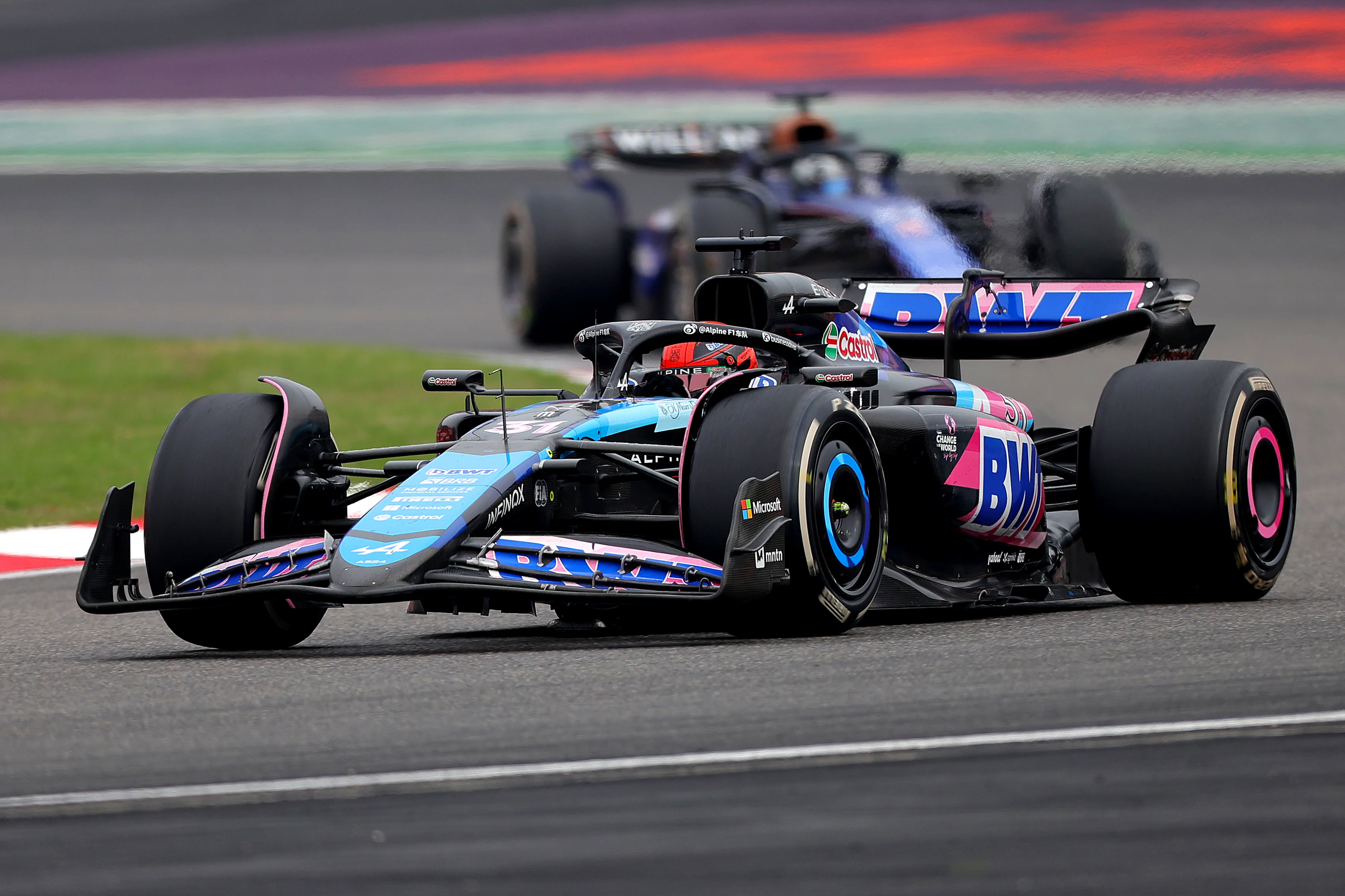 SHANGHAI, CHINA - APRIL 21: Esteban Ocon of France driving the (31) Alpine F1 A524 Renault leads Alexander Albon of Thailand driving the (23) Williams FW46 Mercedes on track during the F1 Grand Prix of China at Shanghai International Circuit on April 21, 2024 in Shanghai, China. (Photo by Lintao Zhang/Getty Images )