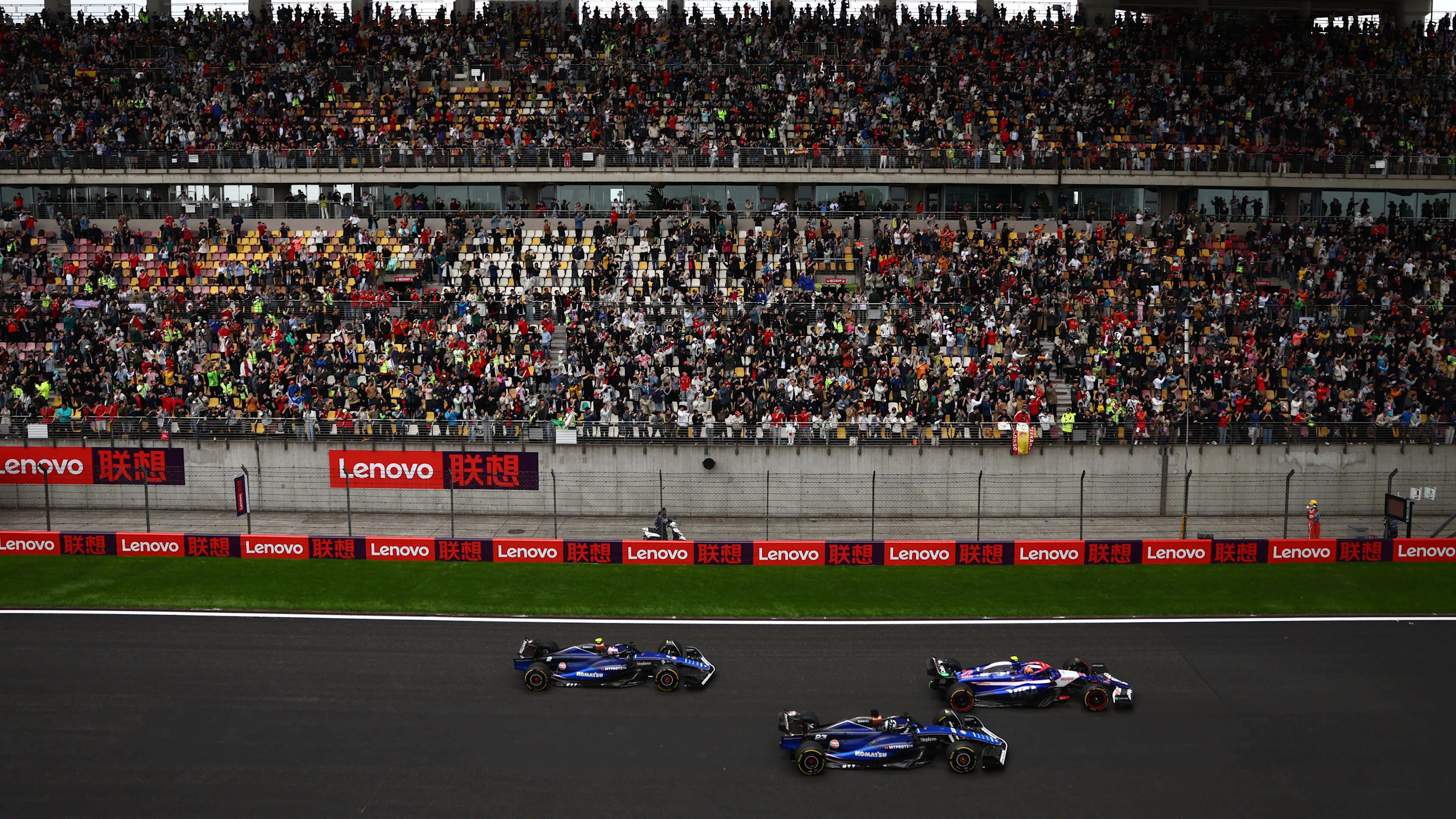 SHANGHAI, CHINA - APRIL 20: Yuki Tsunoda of Japan driving the (22) Visa Cash App RB VCARB 01 leads Alexander Albon of Thailand driving the (23) Williams FW46 Mercedes and Logan Sargeant of United States driving the (2) Williams FW46 Mercedes on track during the Sprint ahead of the F1 Grand Prix of China at Shanghai International Circuit on April 20, 2024 in Shanghai, China. (Photo by Bryn Lennon - Formula 1/Formula 1 via Getty Images)