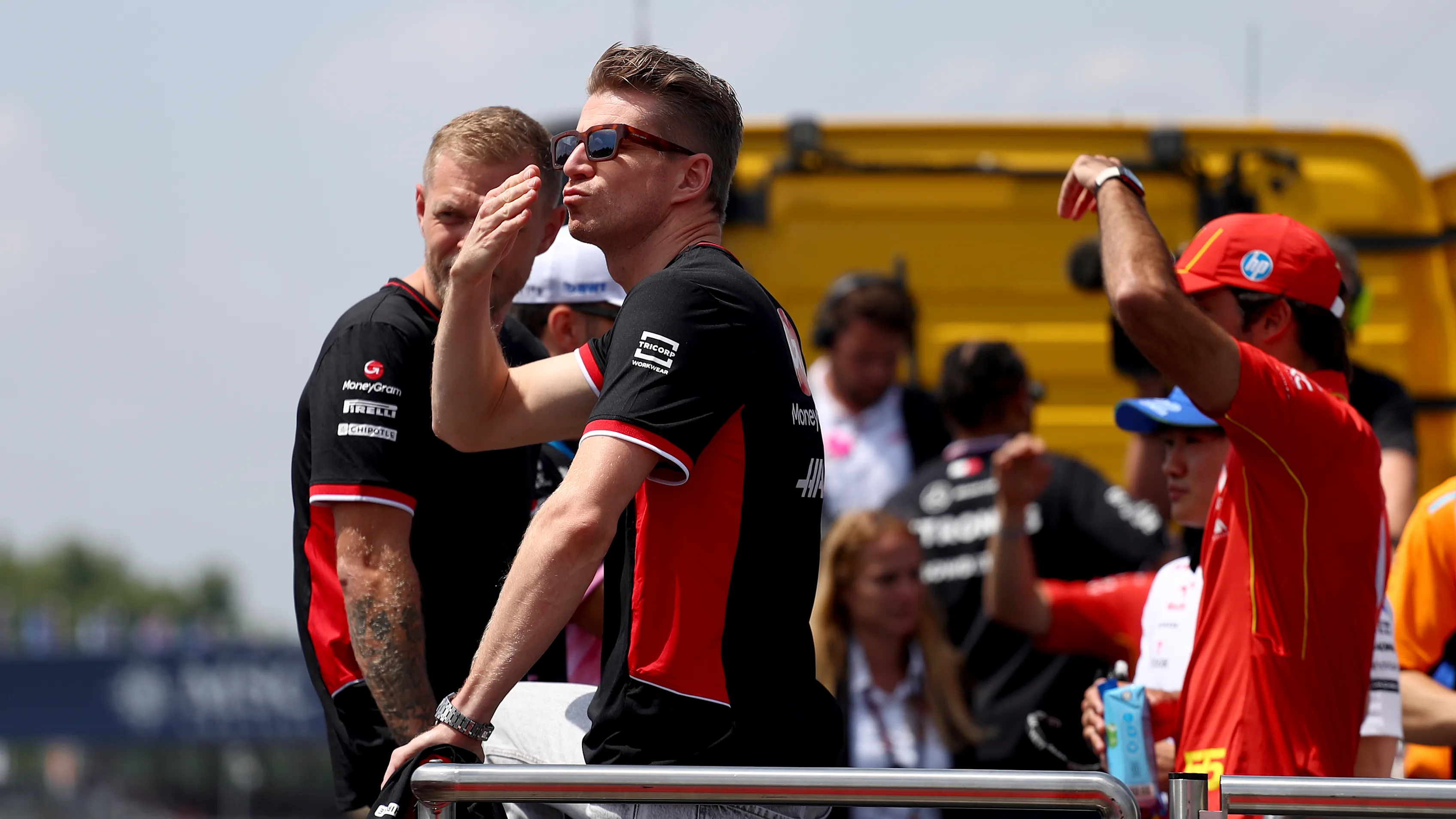 IMOLA, ITALY - MAY 19: Nico Hulkenberg of Germany and Haas F1 blows kisses to the crowd on the drivers parade prior to the F1 Grand Prix of Emilia-Romagna at Autodromo Enzo e Dino Ferrari Circuit on May 19, 2024 in Imola, Italy. (Photo by Peter Fox - Formula 1/Formula 1 via Getty Images)