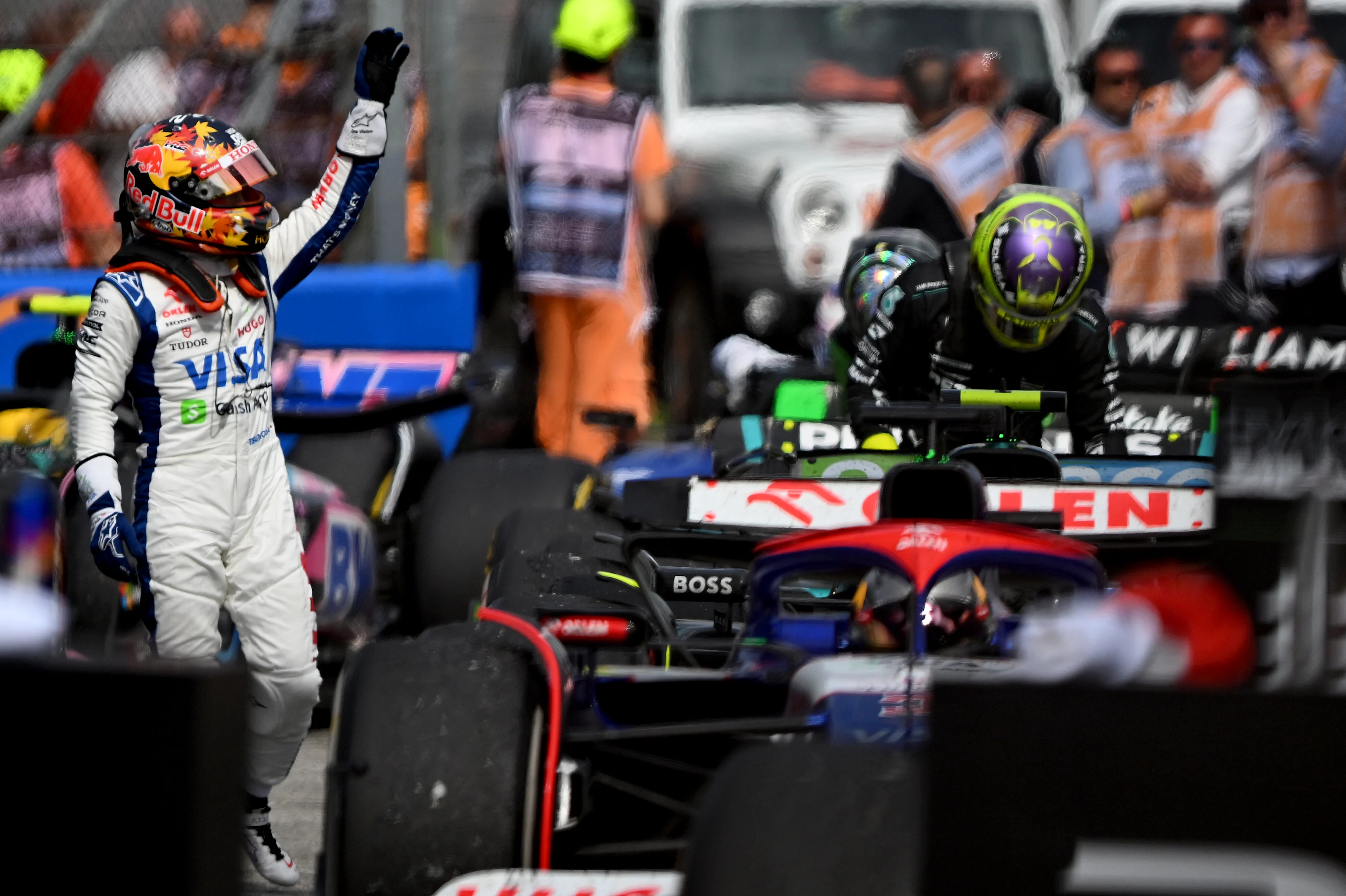 IMOLA, ITALY - MAY 19: 10th placed Yuki Tsunoda of Japan and Visa Cash App RB waves to the crowd in parc ferme during the F1 Grand Prix of Emilia-Romagna at Autodromo Enzo e Dino Ferrari Circuit on May 19, 2024 in Imola, Italy. (Photo by Rudy Carezzevoli/Getty Images)