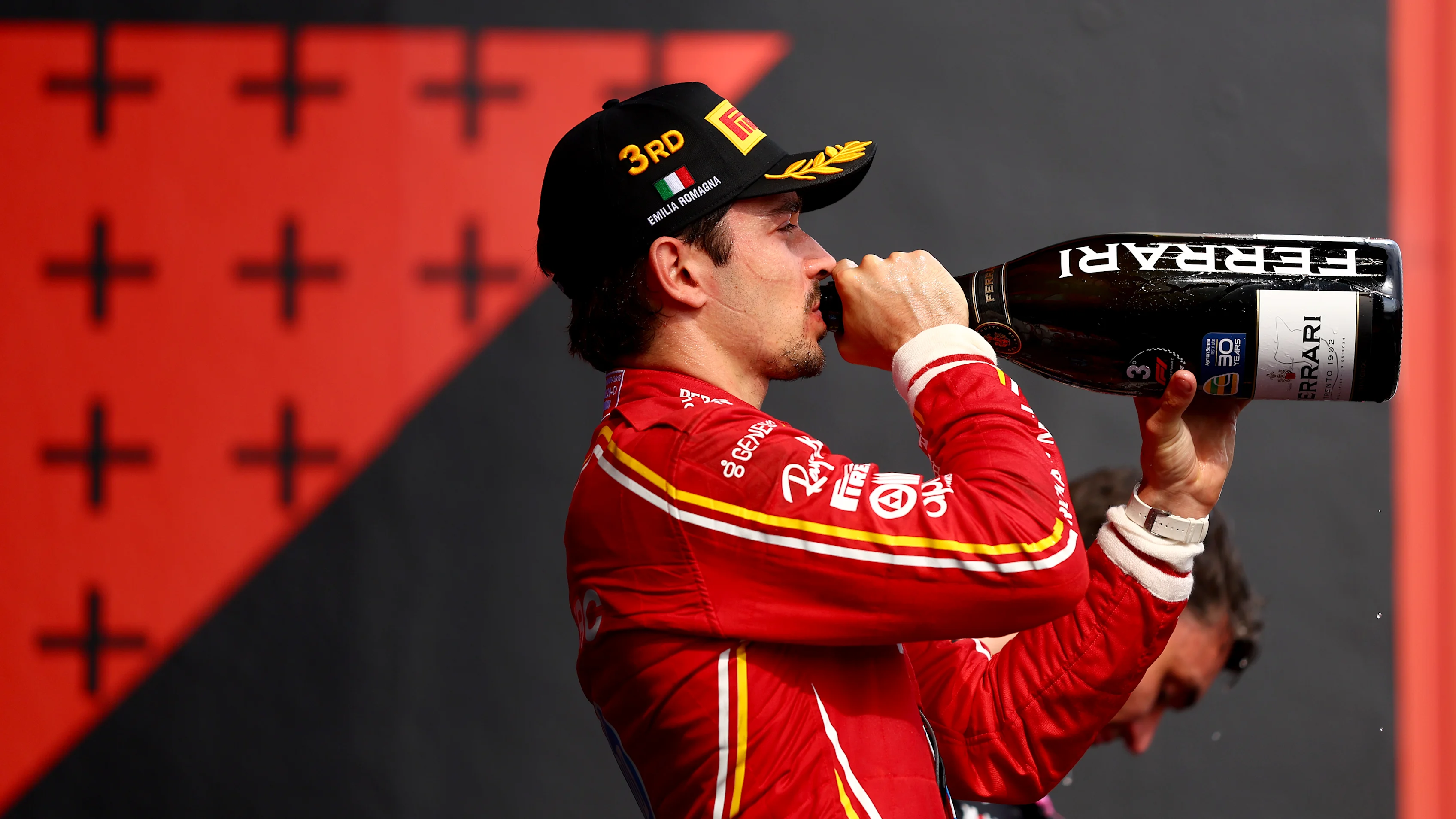 IMOLA, ITALY - MAY 19: Third placed Charles Leclerc of Monaco and Ferrari celebrates on the podium