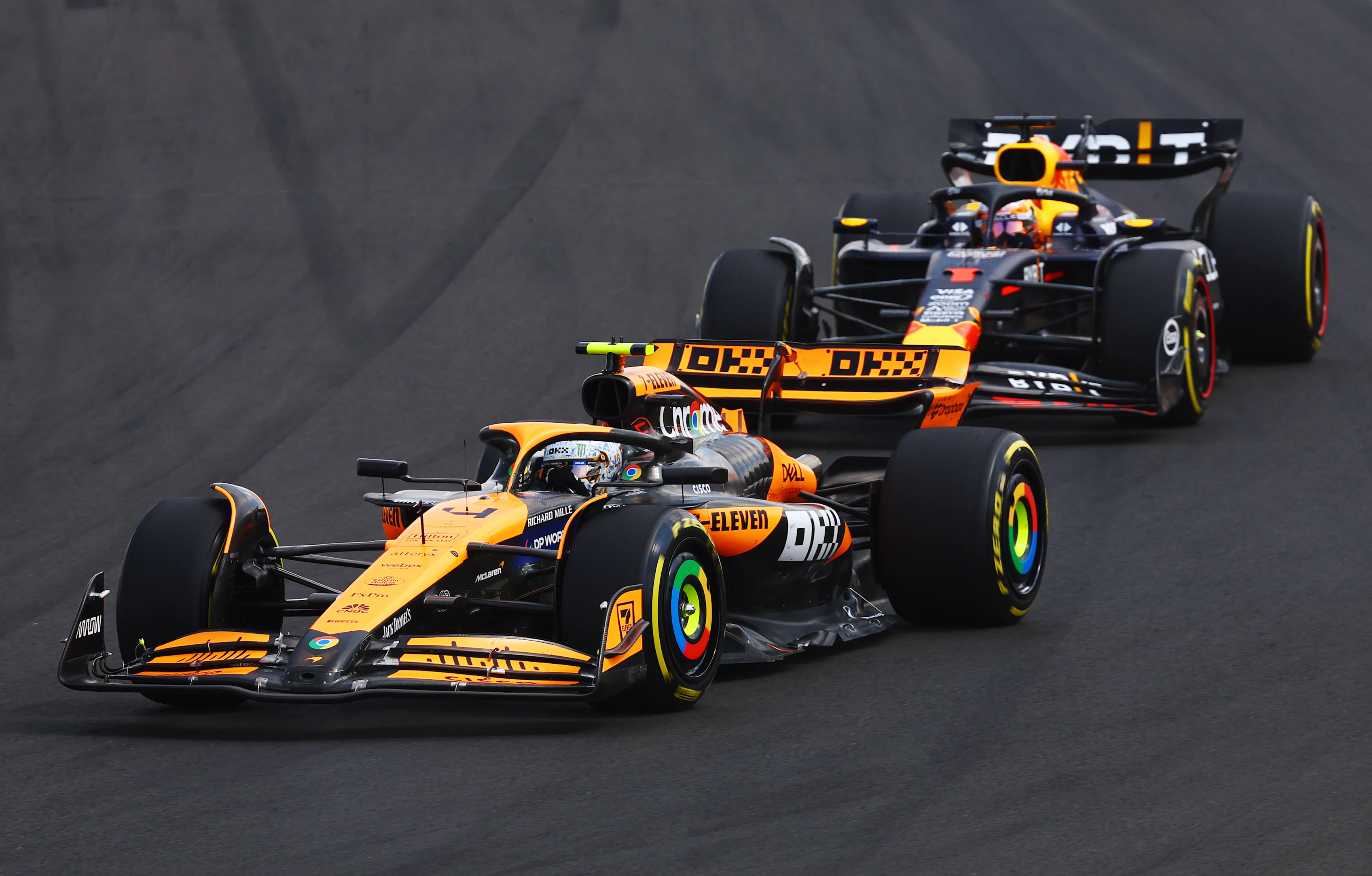 BUDAPEST, HUNGARY - JULY 21: Lando Norris of Great Britain driving the (4) McLaren MCL38 Mercedes leads Max Verstappen of the Netherlands driving the (1) Oracle Red Bull Racing RB20 during the F1 Grand Prix of Hungary at Hungaroring on July 21, 2024 in Budapest, Hungary. (Photo by Mark Thompson/Getty Images)