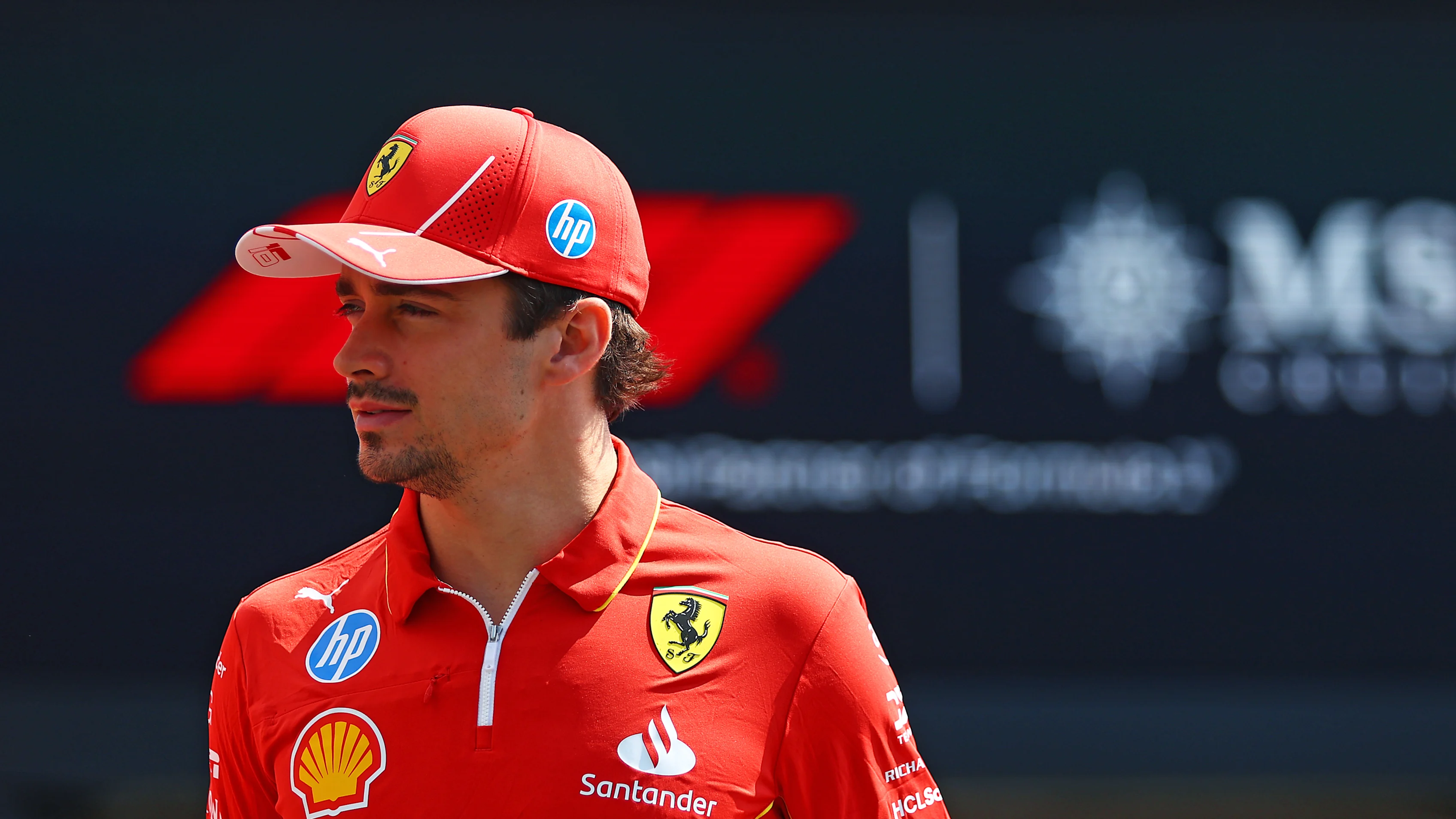 BUDAPEST, HUNGARY - JULY 18: Charles Leclerc of Monaco and Ferrari walks in the Paddock during